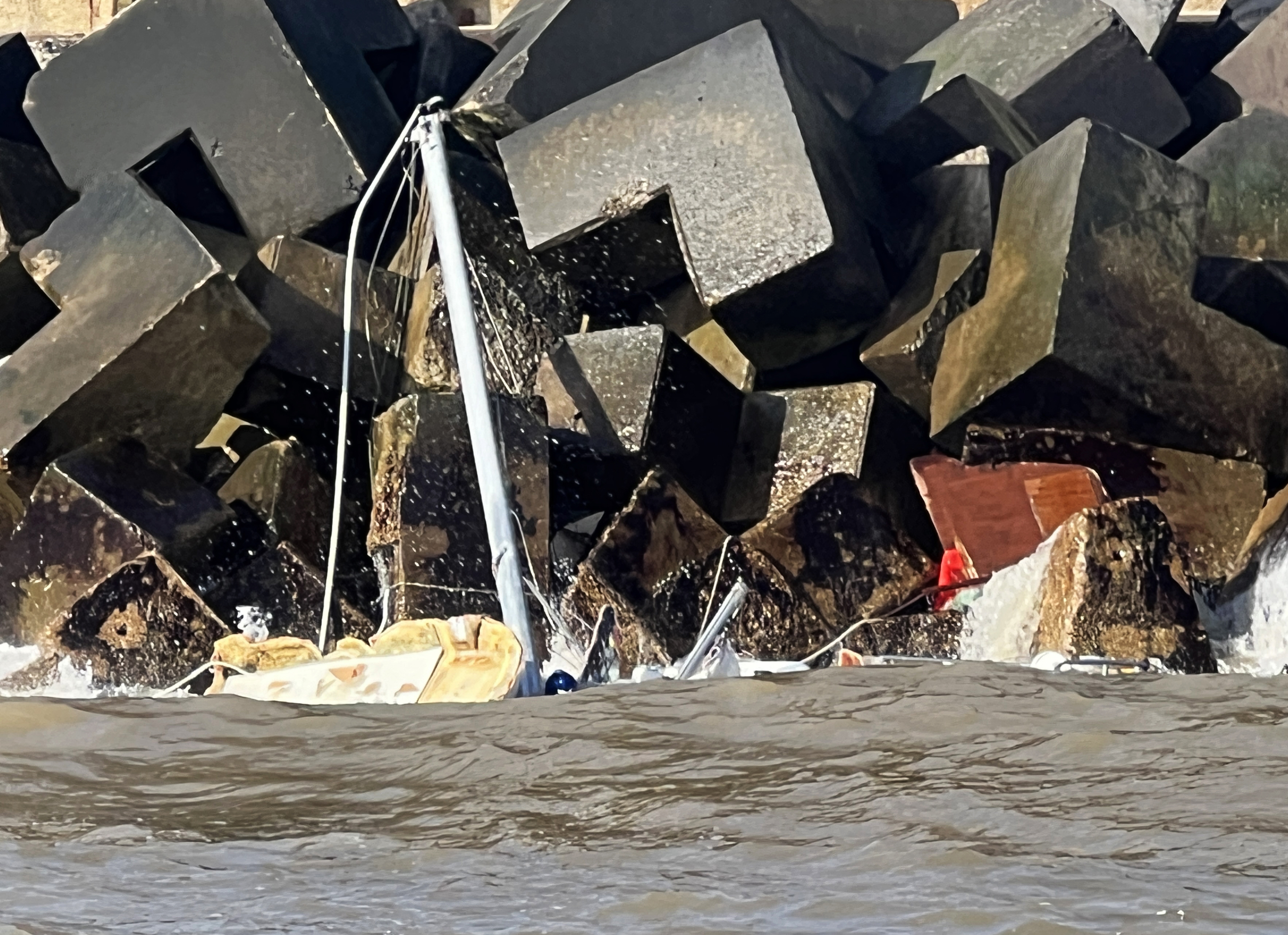 The stranded yacht on the rocks