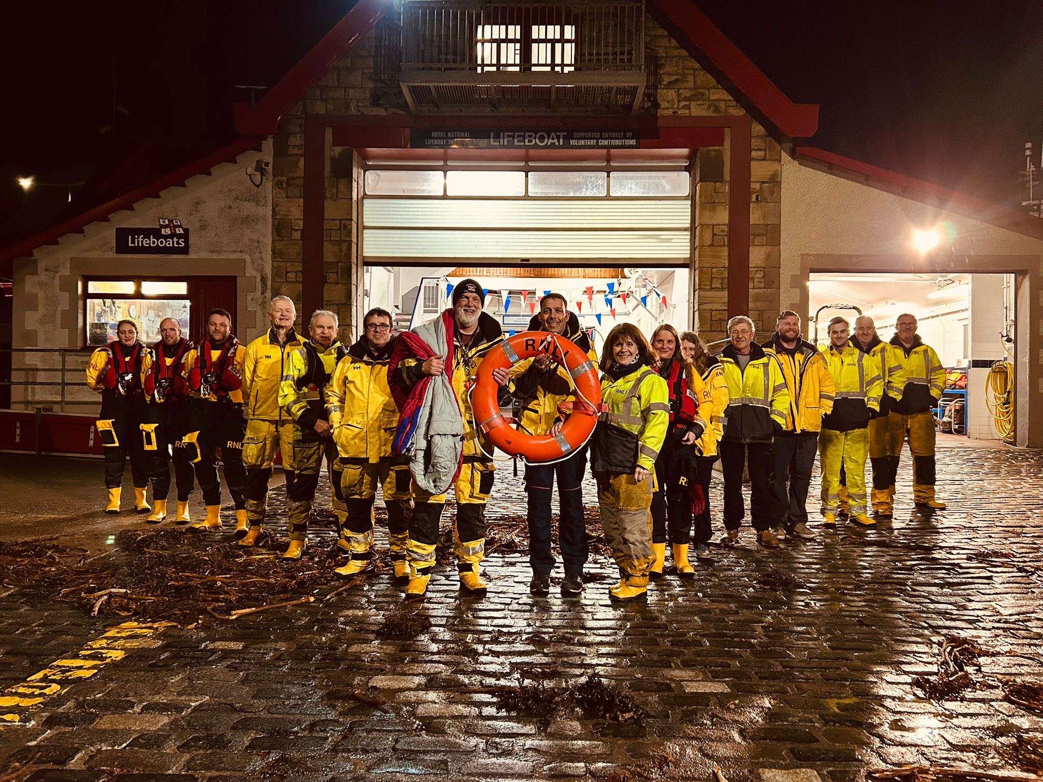 The picture shows the Anstruther RNLI Crew outside the Anstruther Lifeboat Station promoting their forthcoming fundraising event for Royal British Veterans Enterprise.