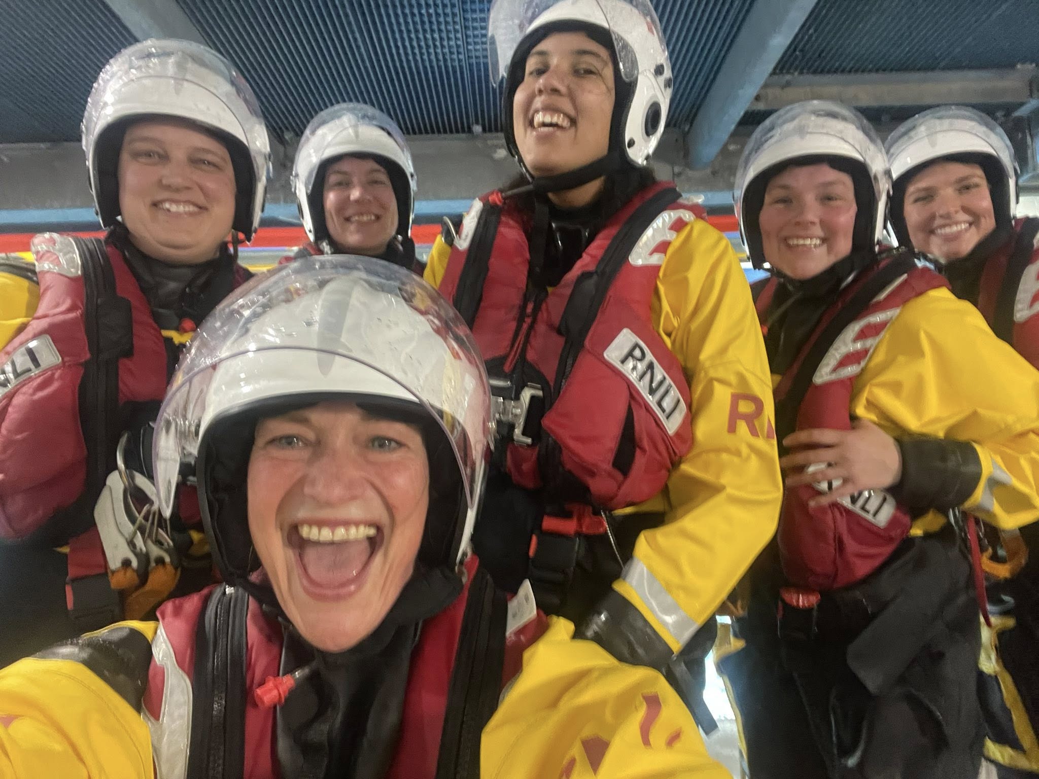 RNLI crew members wearing full kit while training at Poole as part of women in SAR week