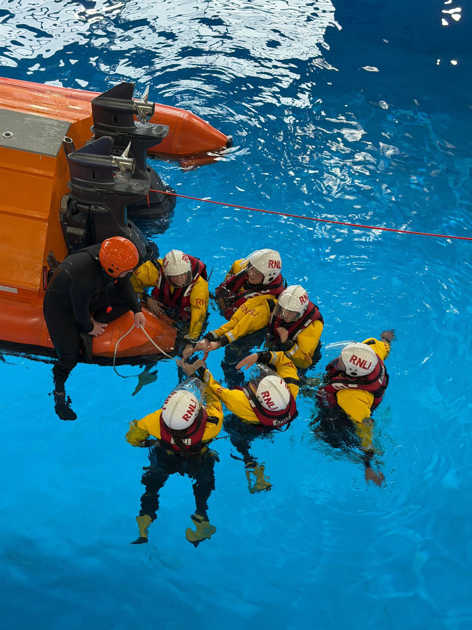 RNLI crew members in the training pool at RNLI College