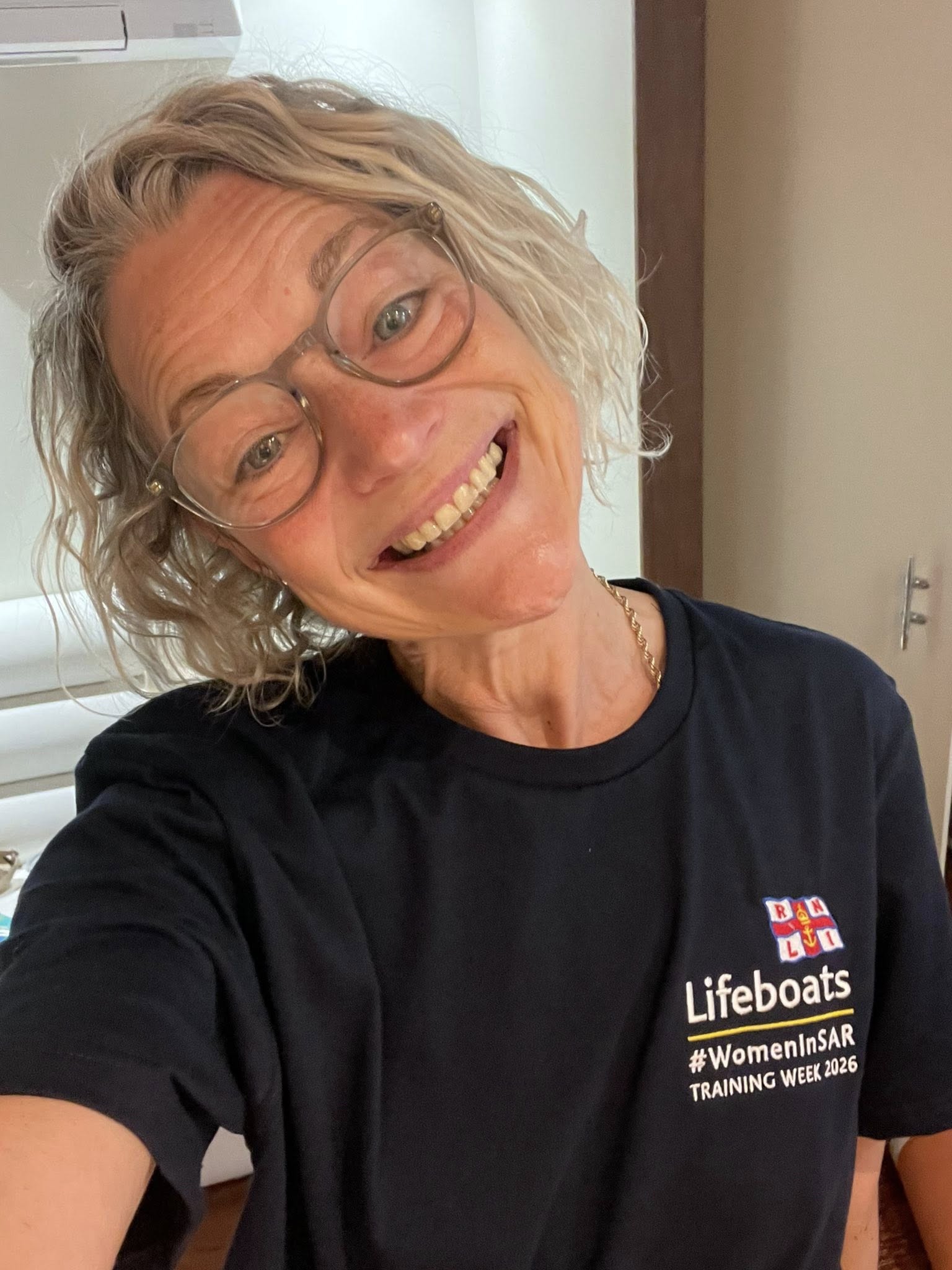 RNLI Aberdyfi crew member Gemma Chance wearing her Women in SAR t-shirt