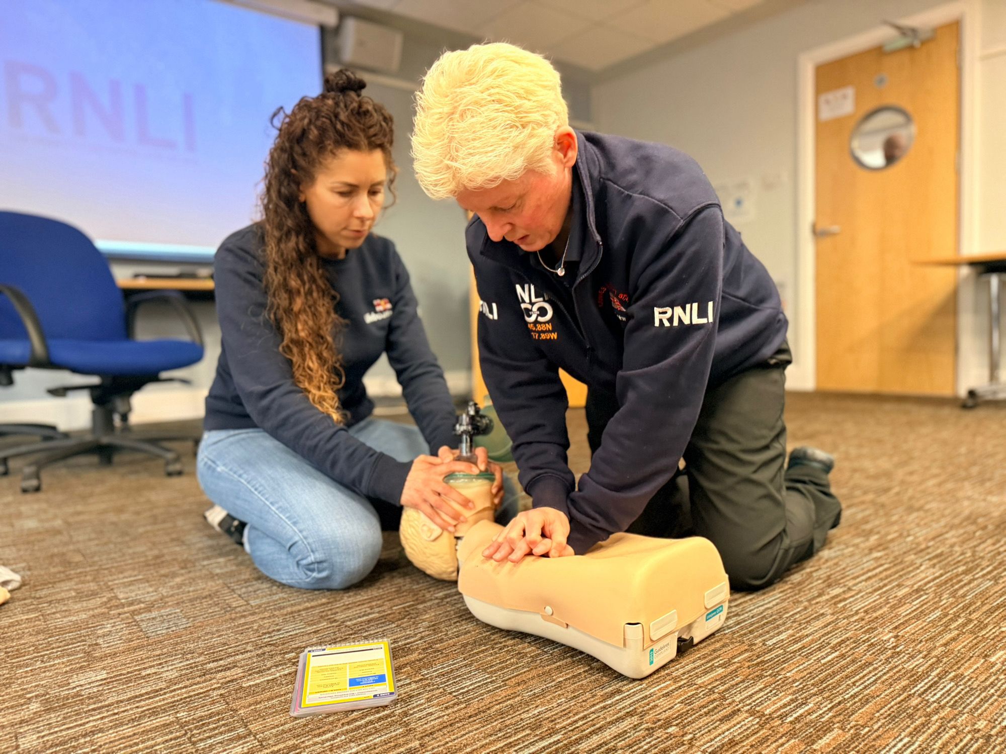 Nicky being coached in casualty care at sea.