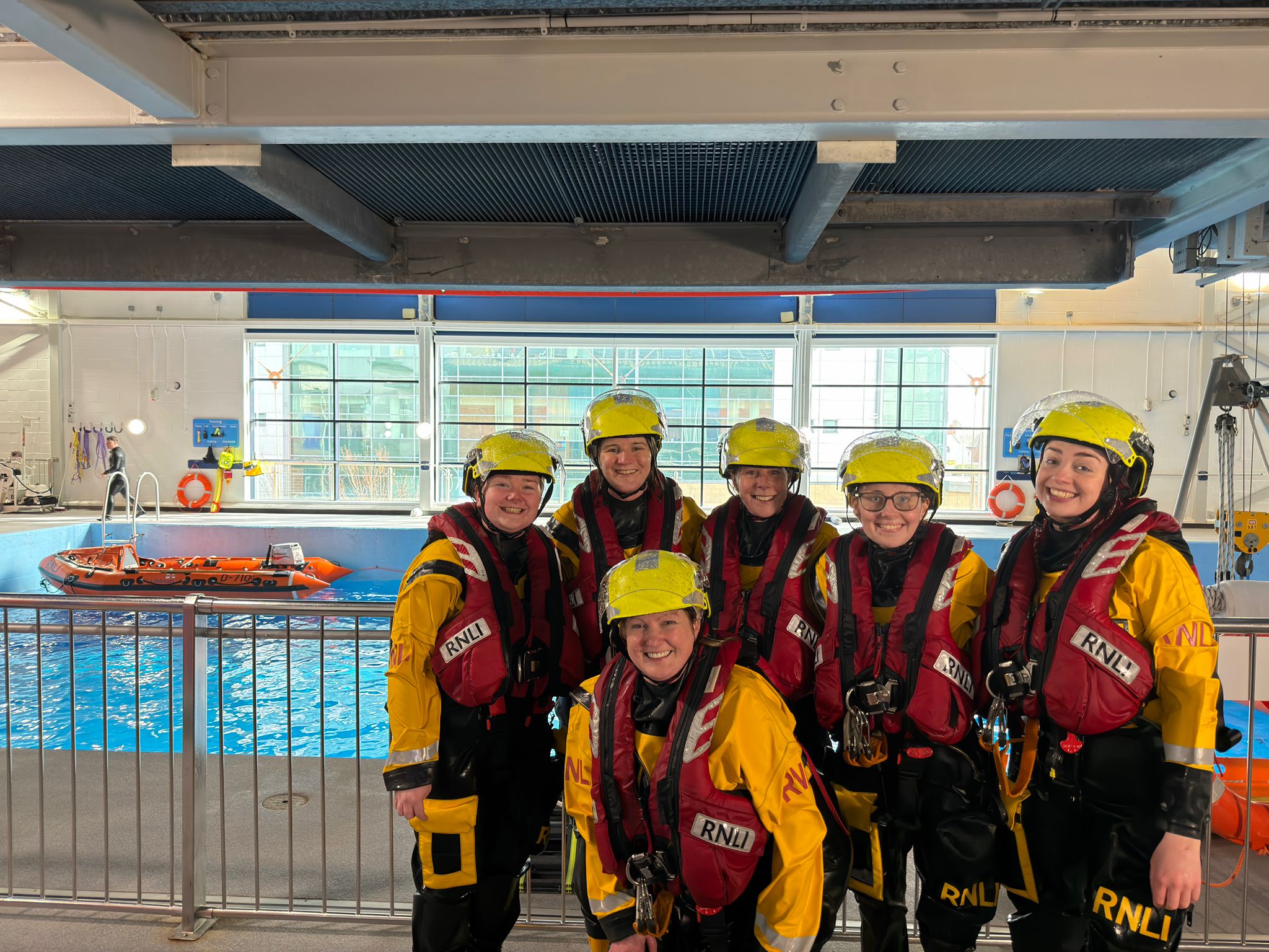 Six women in RNLI gear.