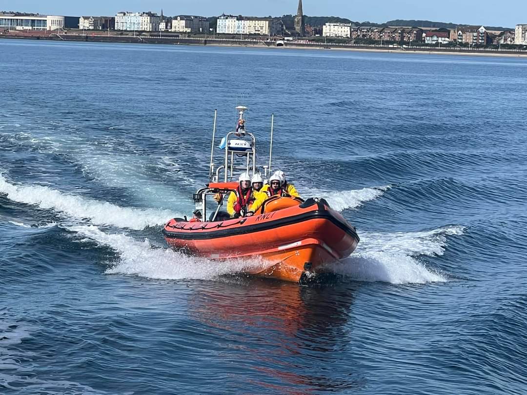 Photo taken from a larger boat showing the lifeboat from the bow