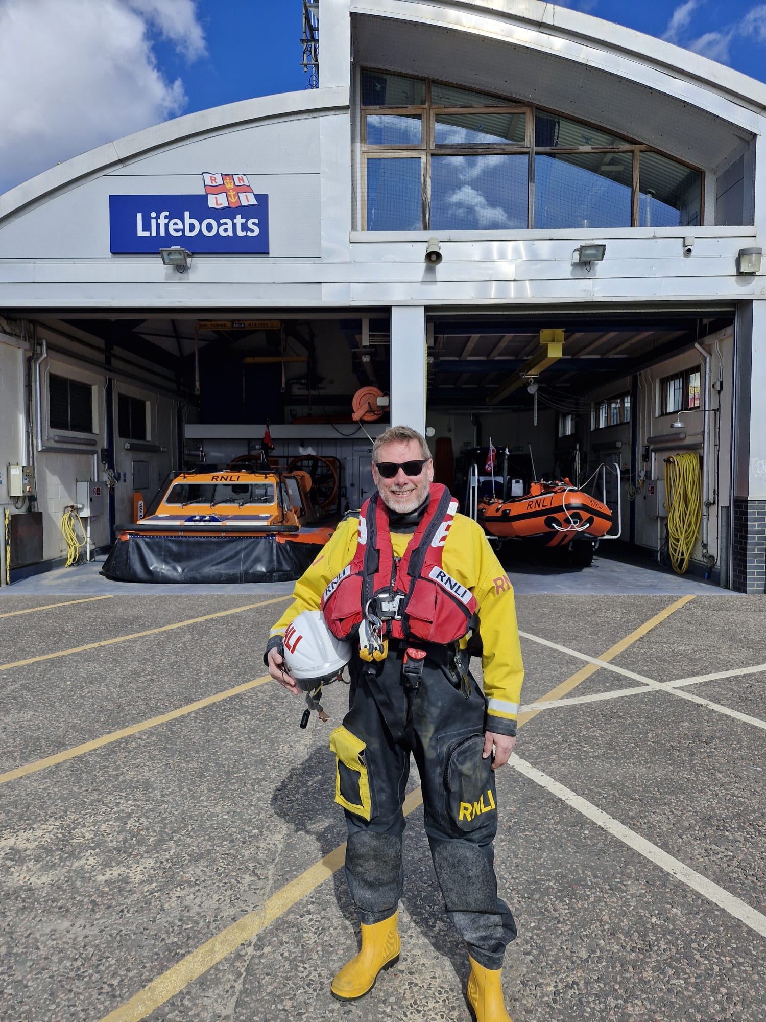 Chris Nicholls in full PPE standing in front of Southend inshore boathouse