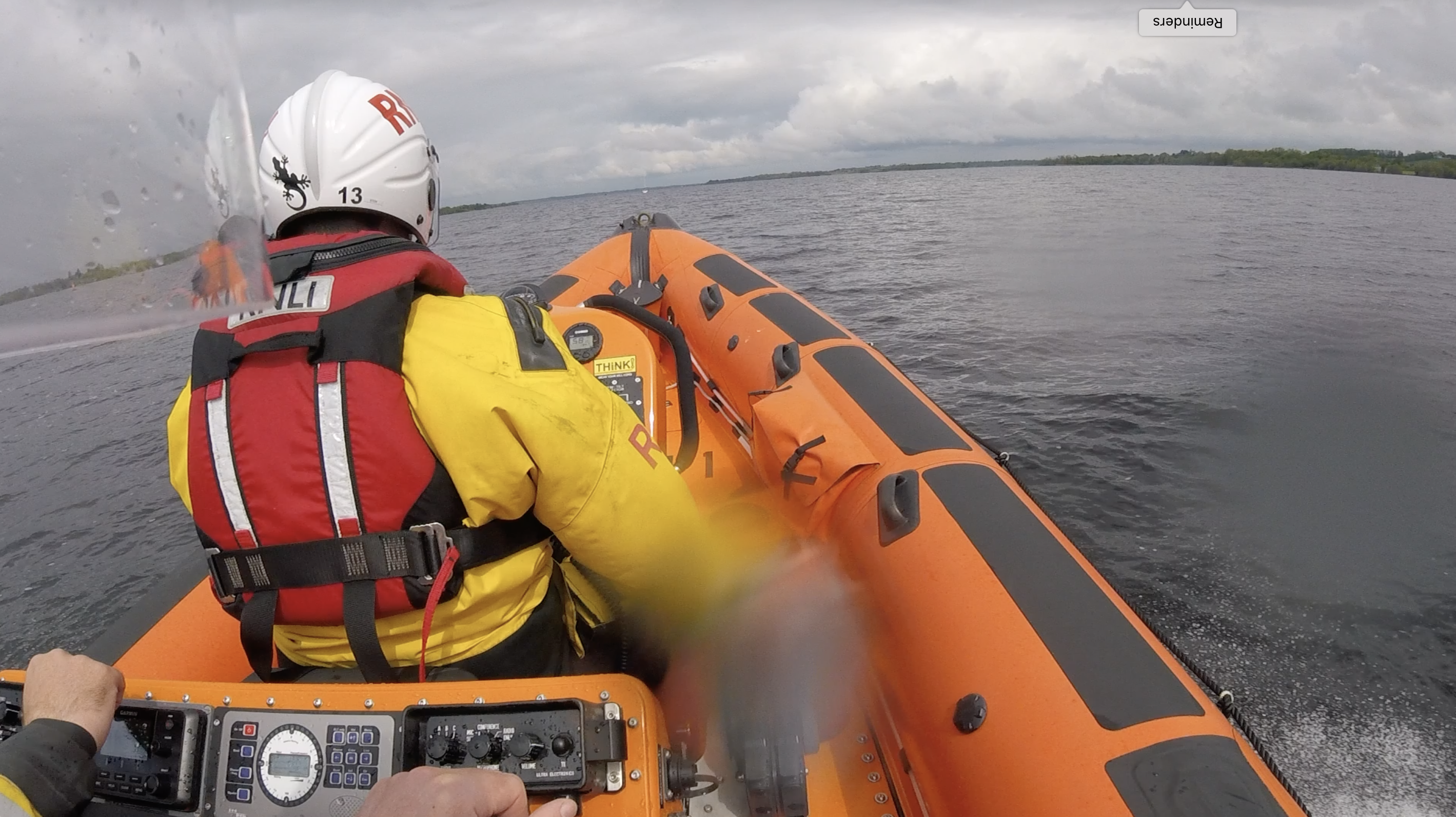 View from seat 3 over the right shoulder of the helm, with the casualty vessel just visible in the distance over the bow