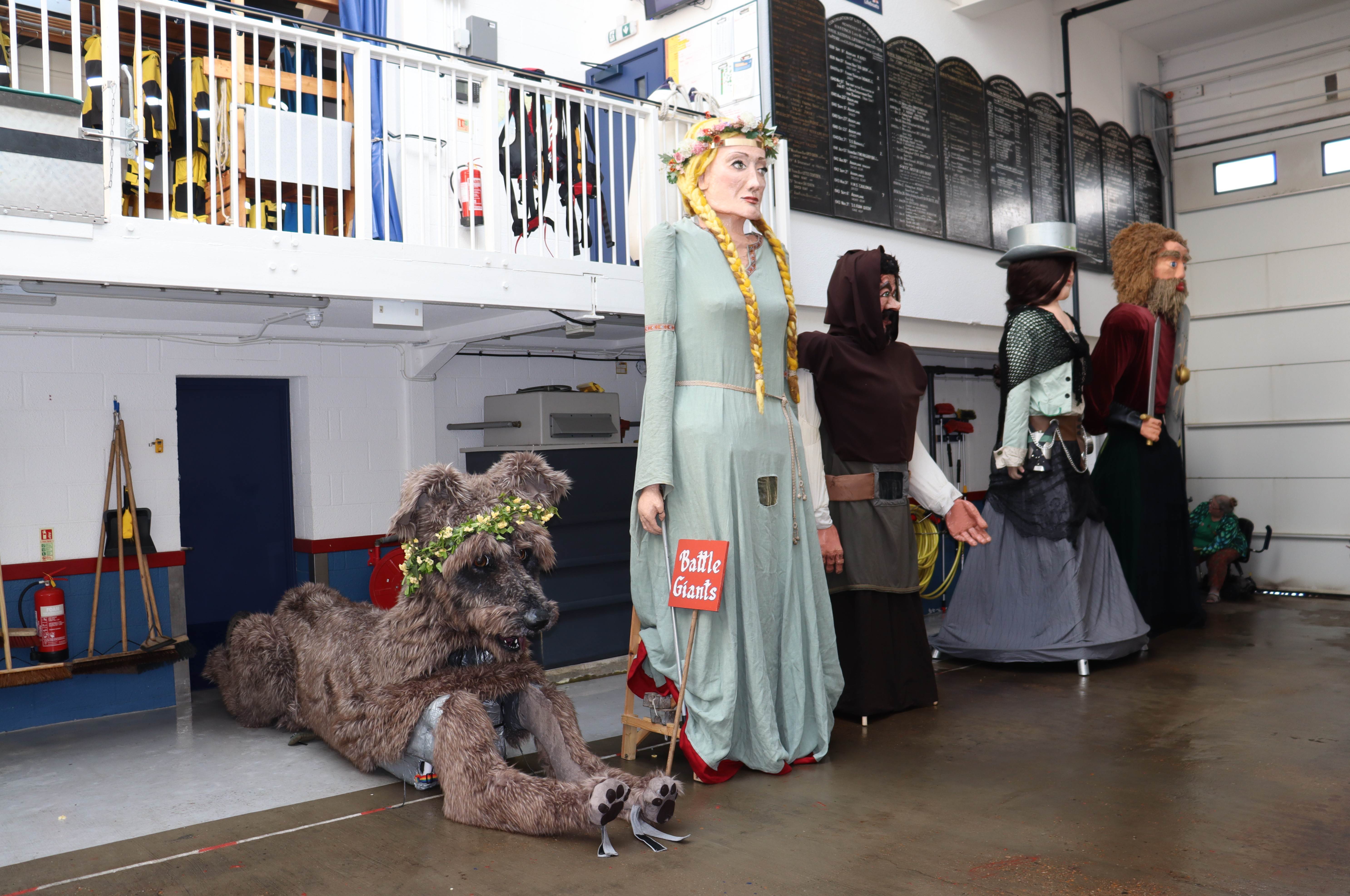 Five giant characters inside the boat hall at Hastings