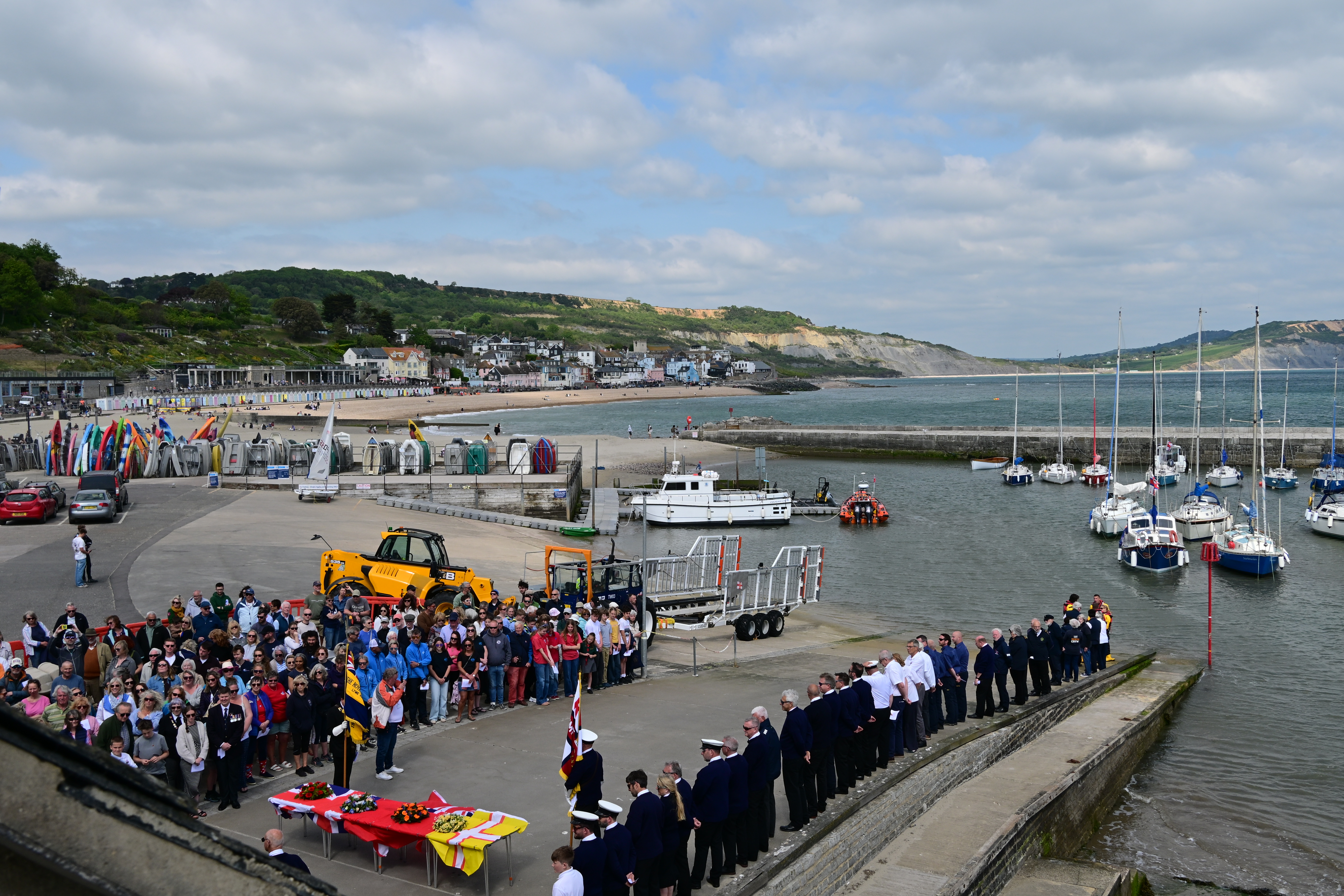 View of harbour with crowd of people 