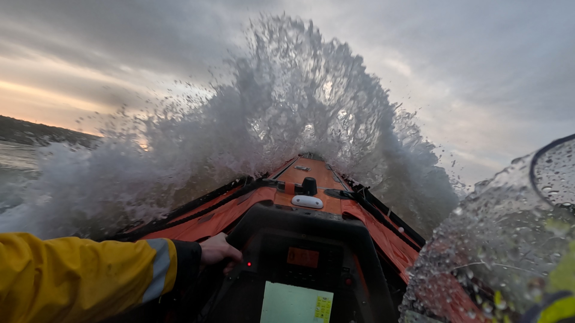 A still from the camera worn by one of the volunteer crew during the shout showing a wavebreaking on the bow as the lifeboat pushed through the swell.