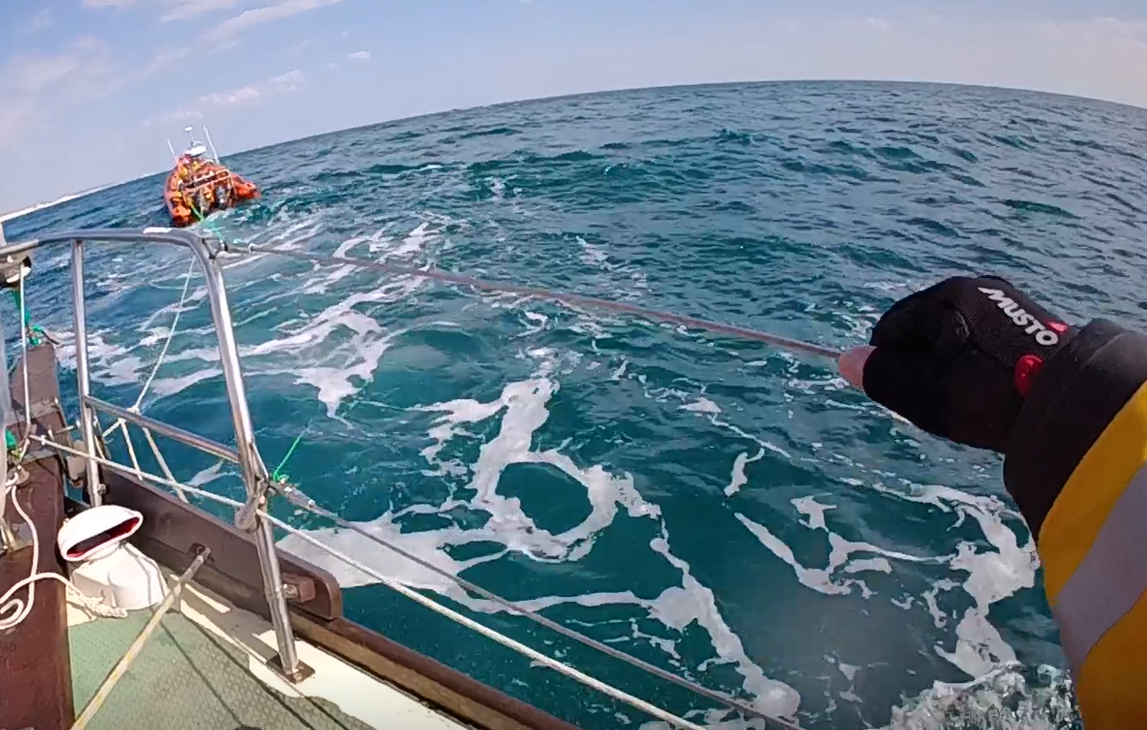 Brighton RNLI’s inshore lifeboat tows a stricken vessel back to Brighton Marina after it suffered engine failure and began drifting offshore.