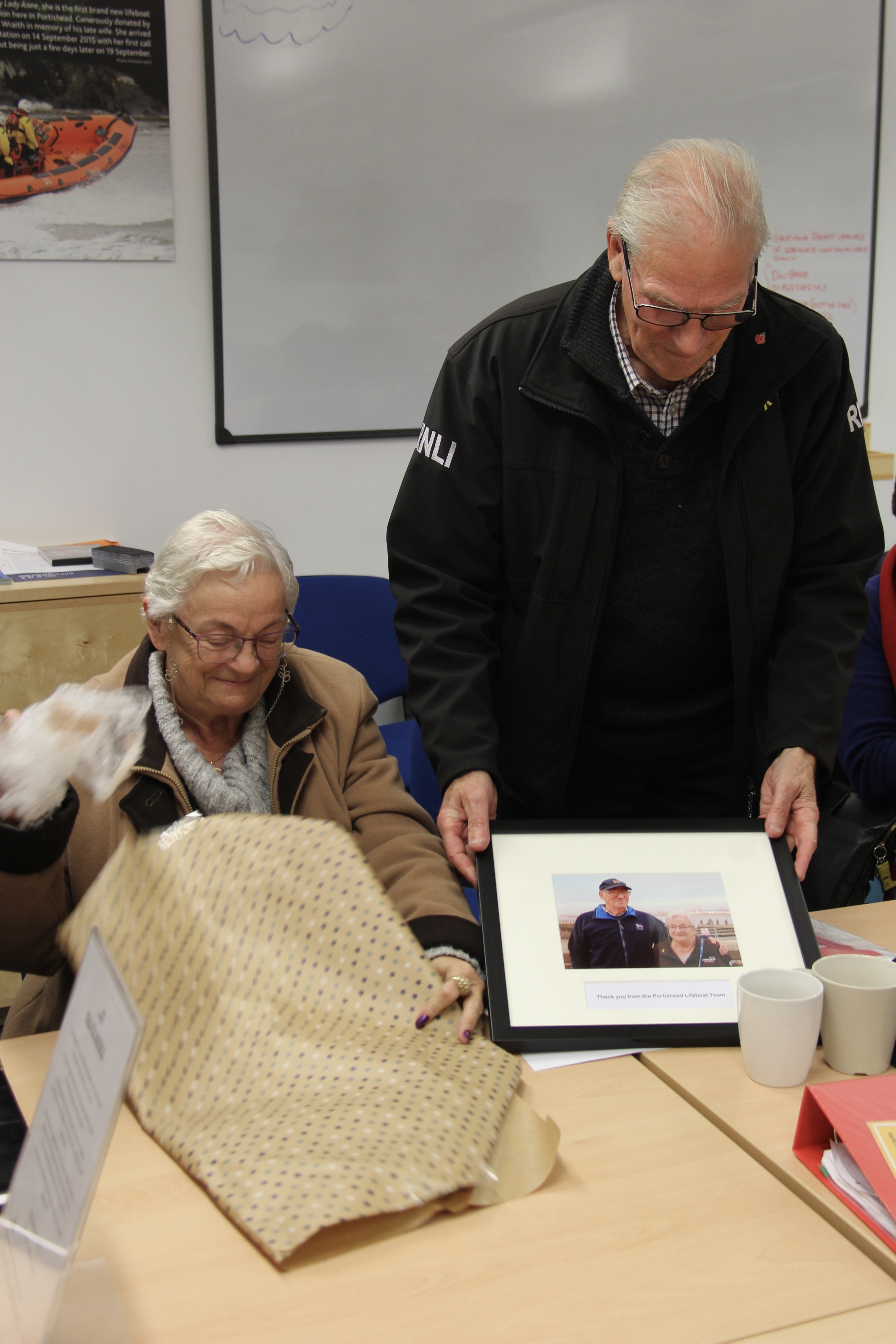 Derek receiving his 20 year award for volunteering, Pauline at his side