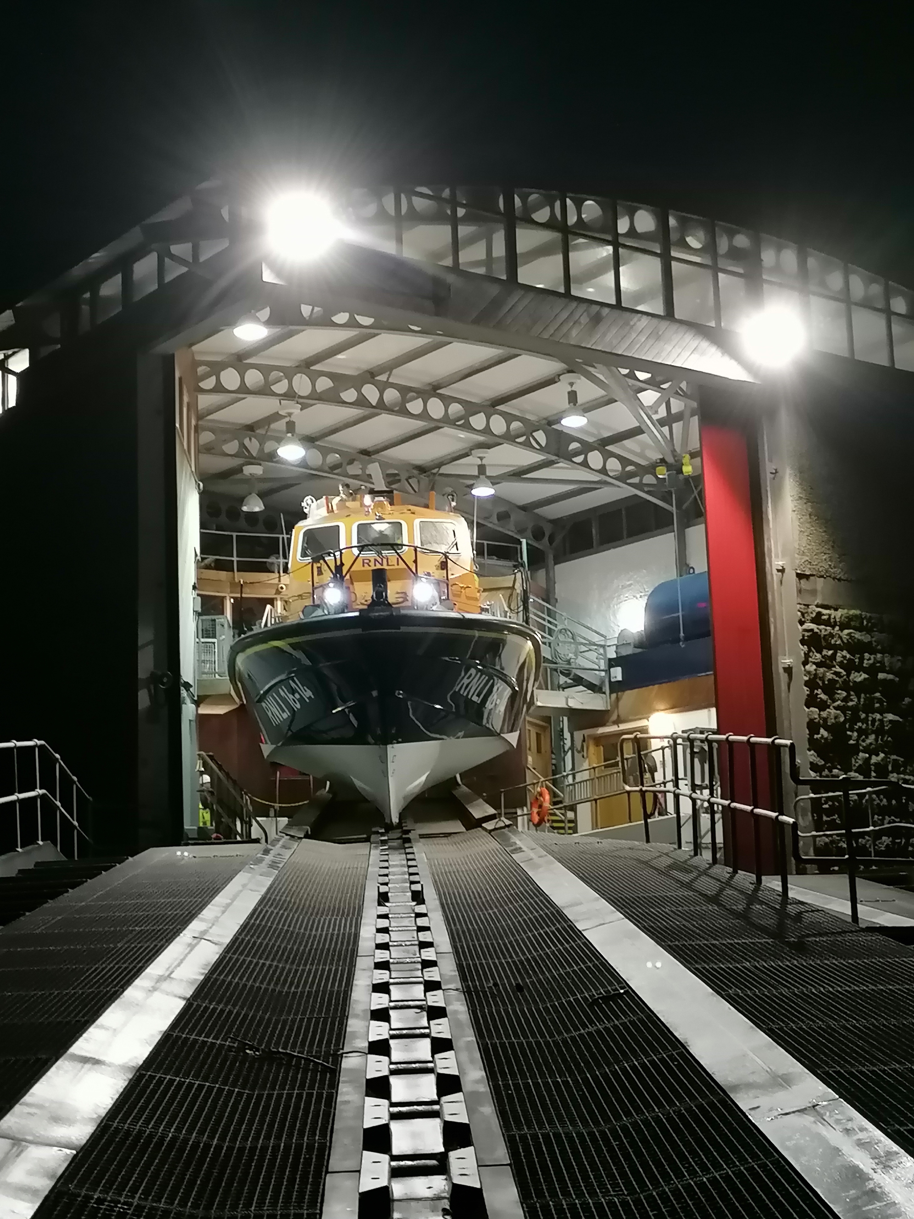 Sennen Cove tamar class lifeboat 'City of London III' in the boathouse at night.
