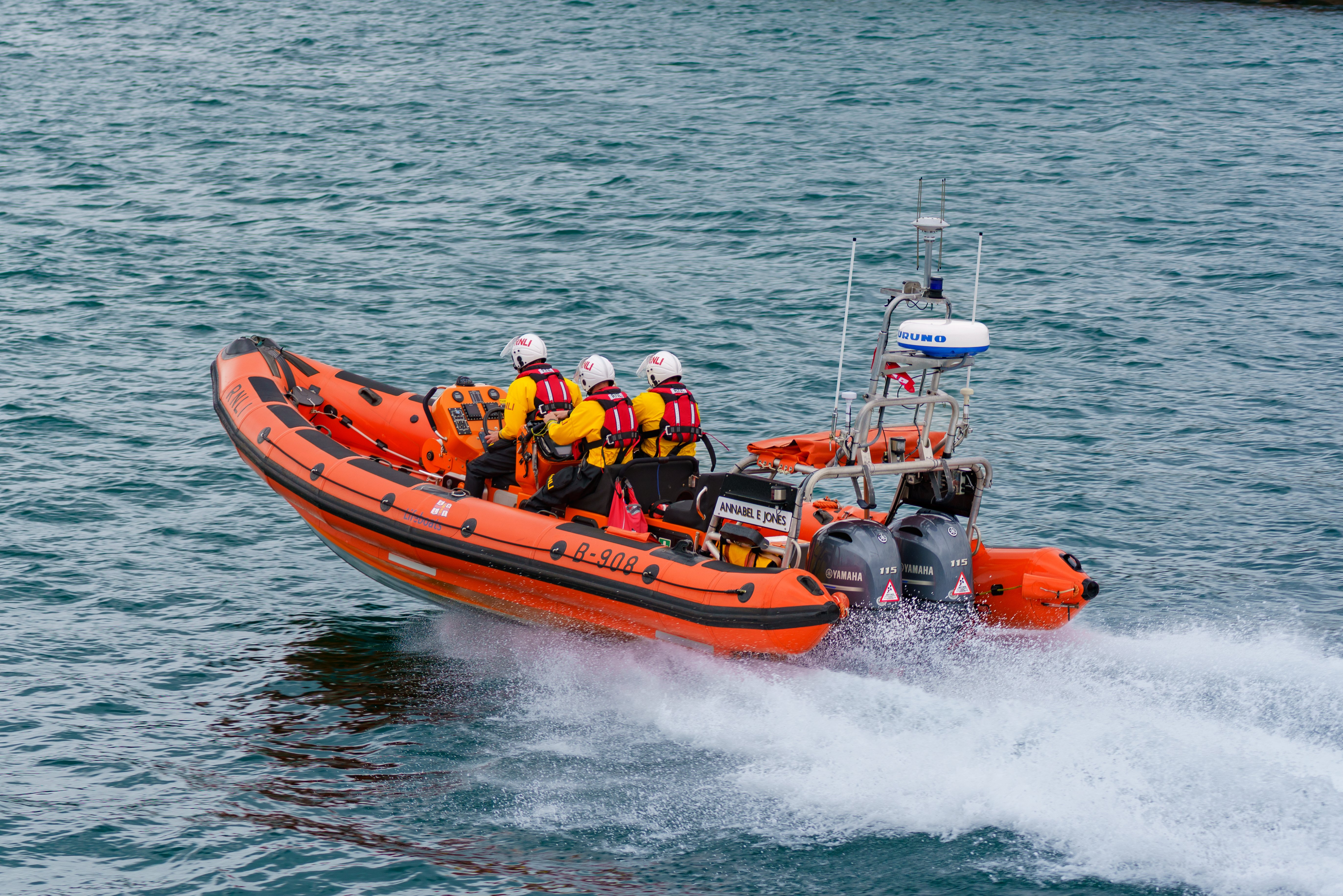 Inshore Lifeboat driving at speed across water