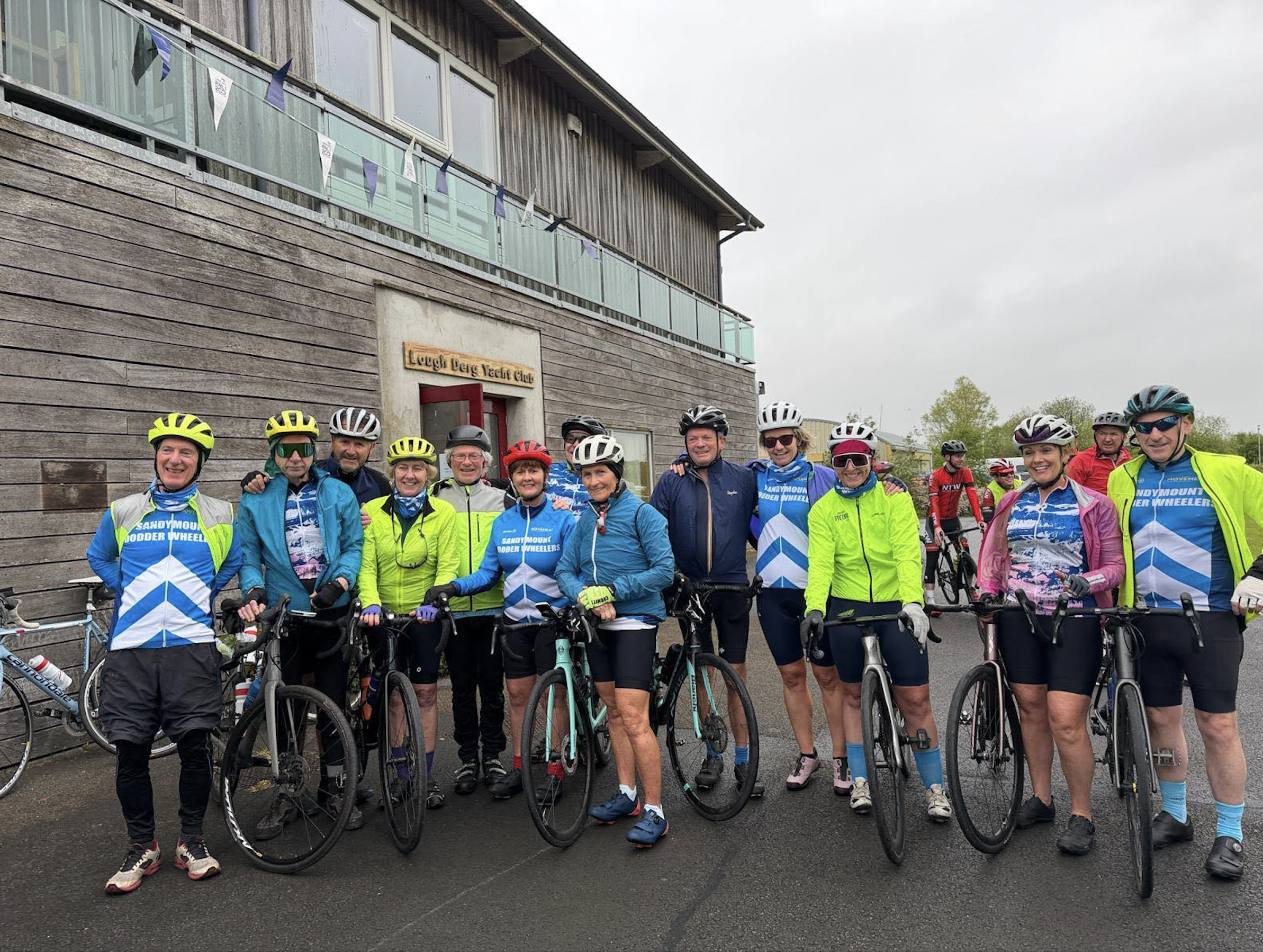 Cyclists in a line by the entrance to Lough Derg Yacht Club