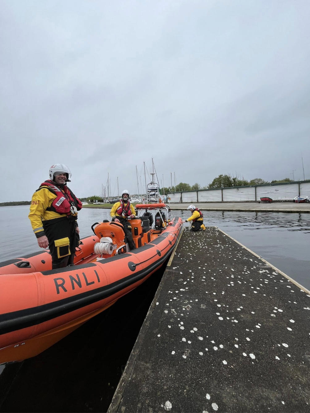 Crew of Lough Derg RNLI Lifeboat Jean Spier getting reading to cast off and set off to meet cyclists are various stop points around the lake
