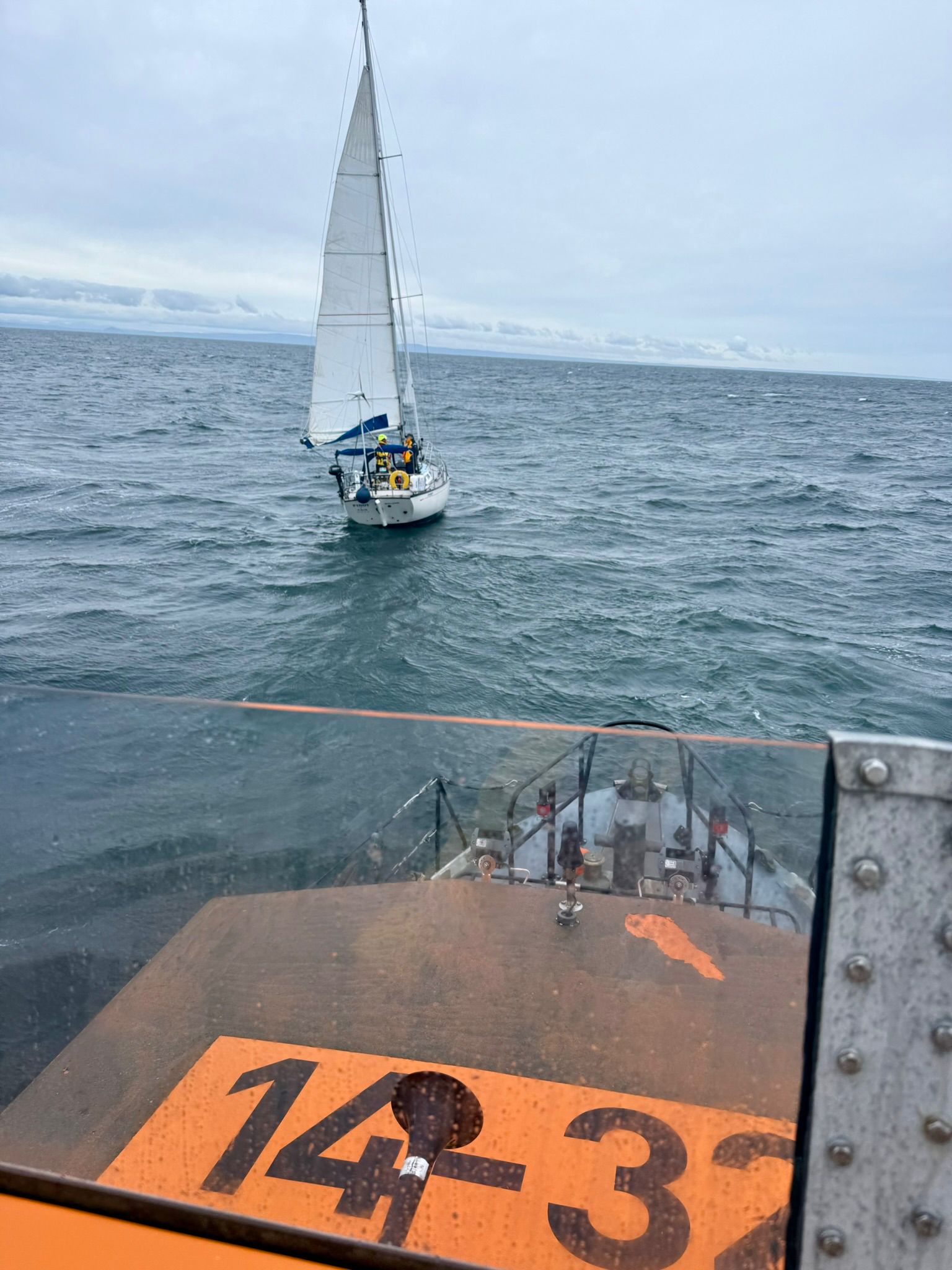 Red Bay RNLI assists lone sailor with the vessel in the distance