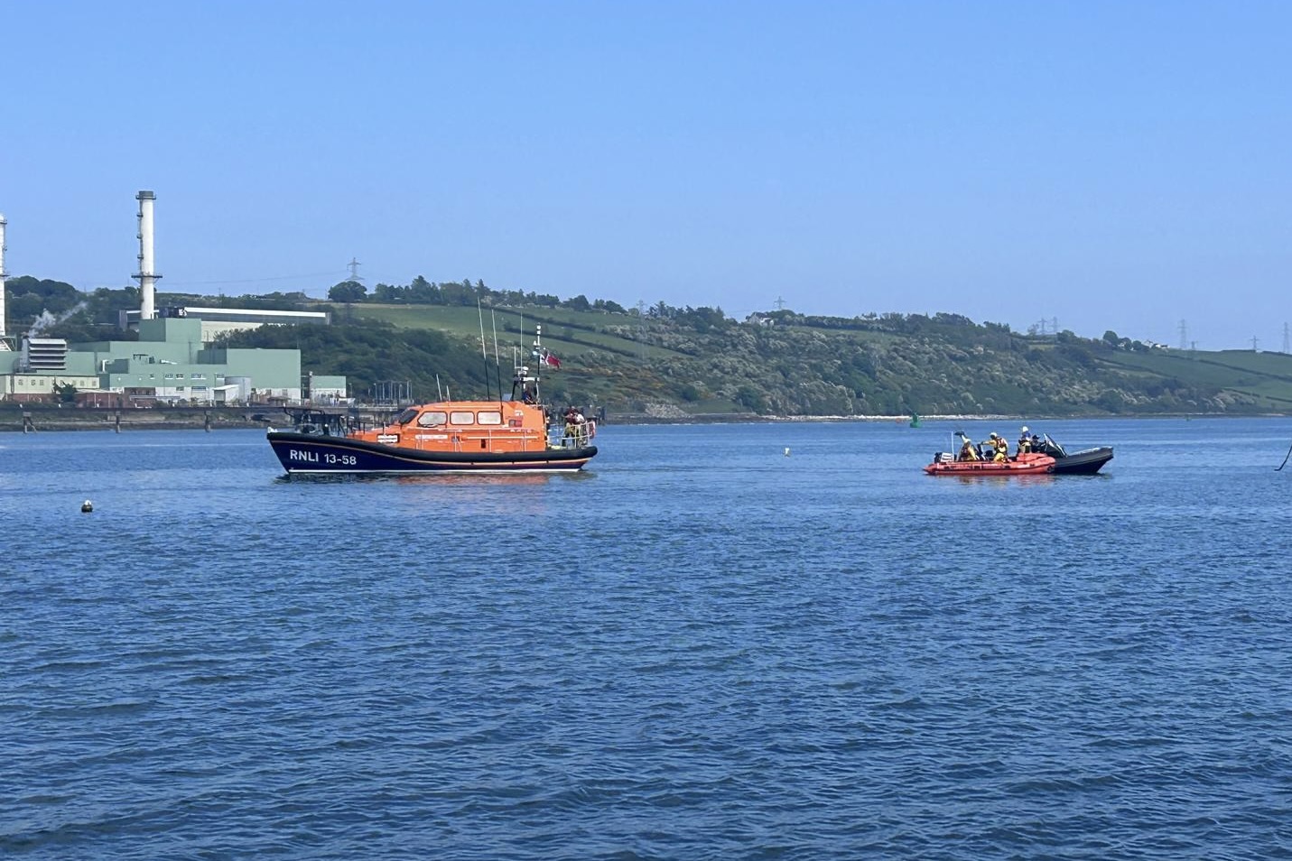 Larne RNLI's all-weather lifeboat Machiko Nancy and their inshore lifeboat Terry assist the casualties during todays rescue