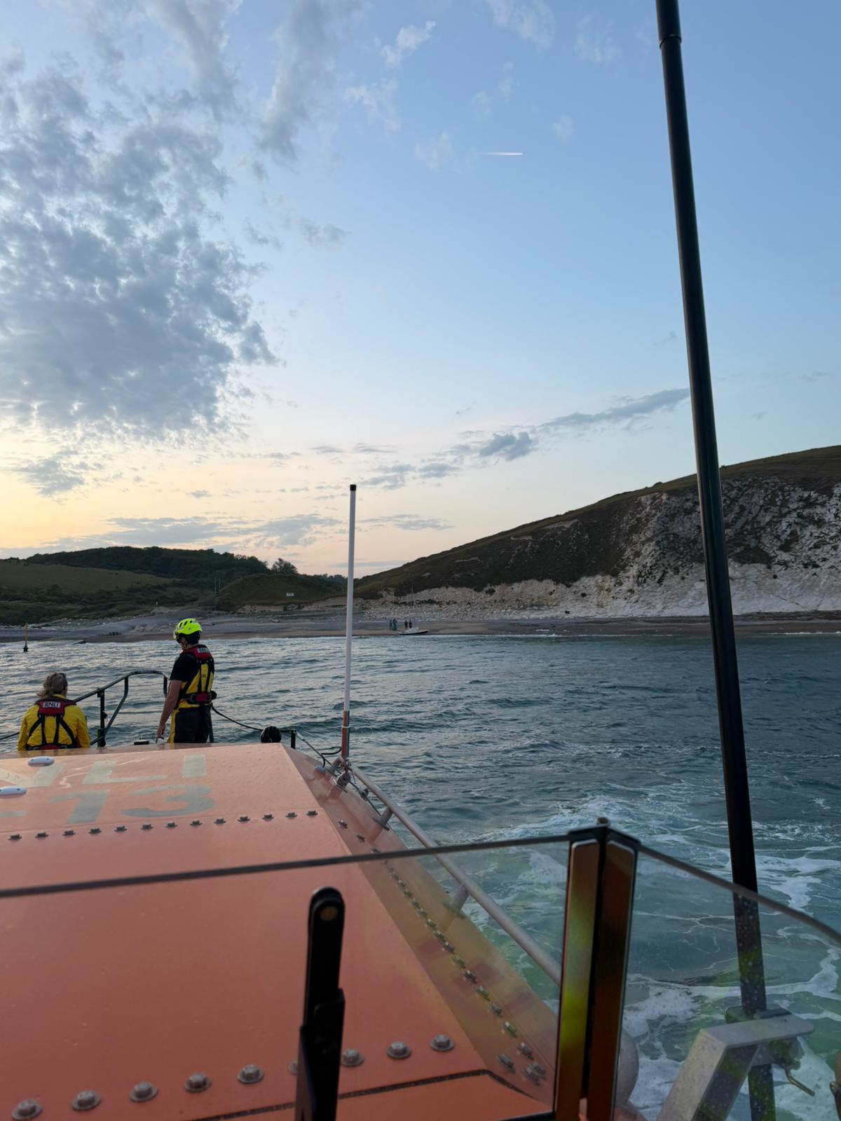 Swanage ALB overlooking the Arish Mell Gap where the small sailing boat has washed ashore.