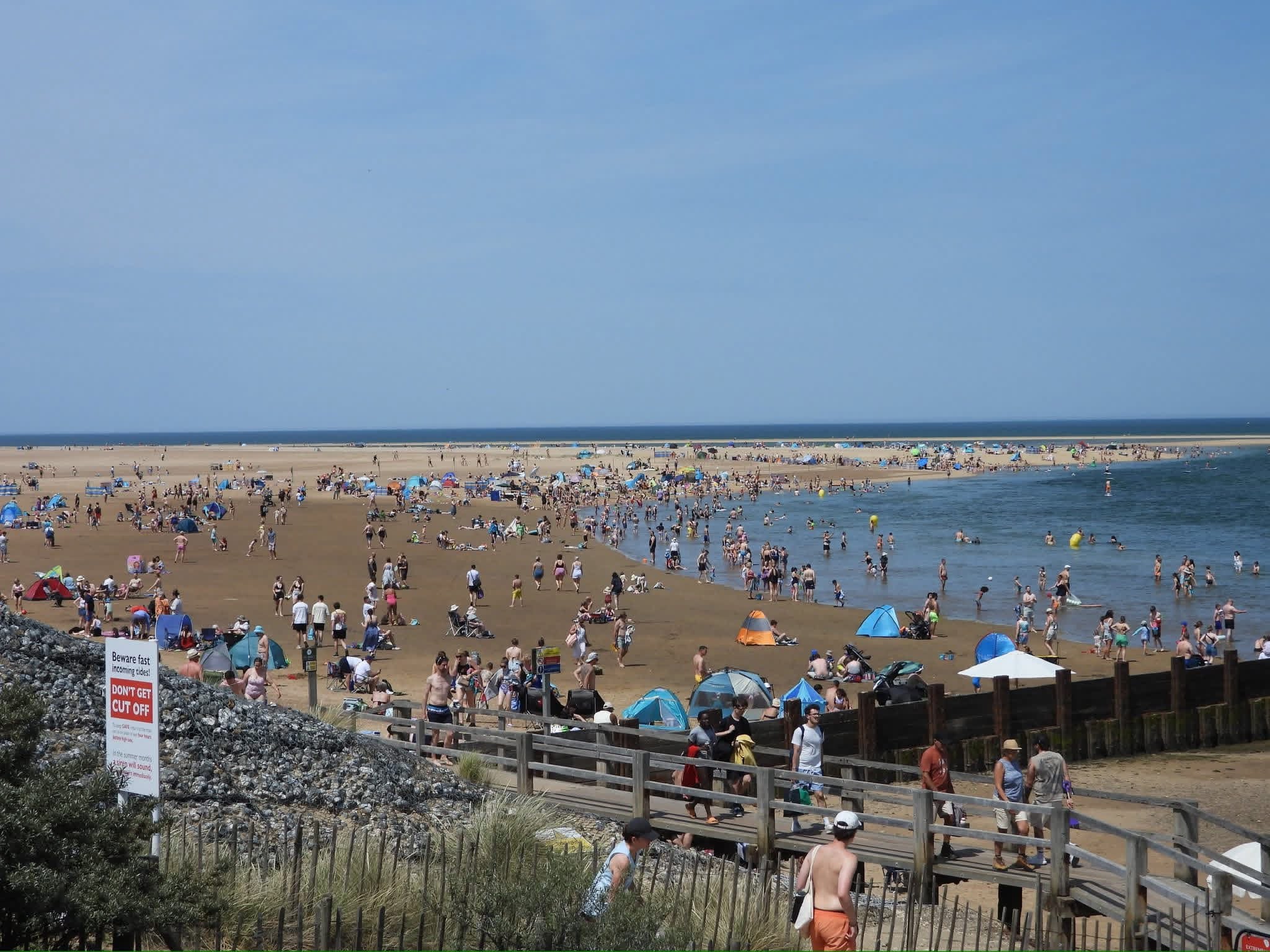 Wells Beach full of people on a busy summers day 