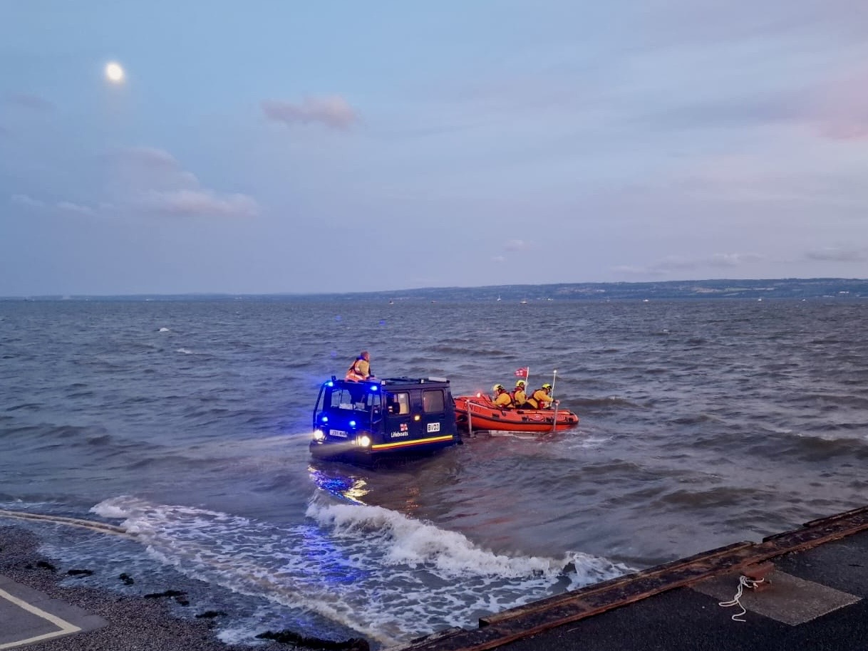 The lifeboat can be seen recovering onto the BV in the Dee Estuary near West Kirby
