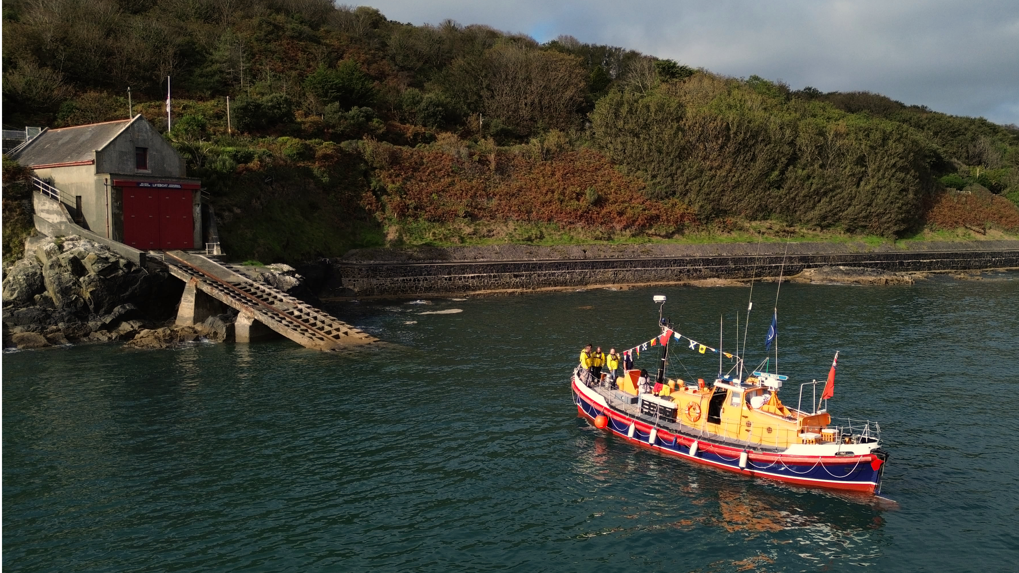 Picture shows a lifeboat beside a launch slipway