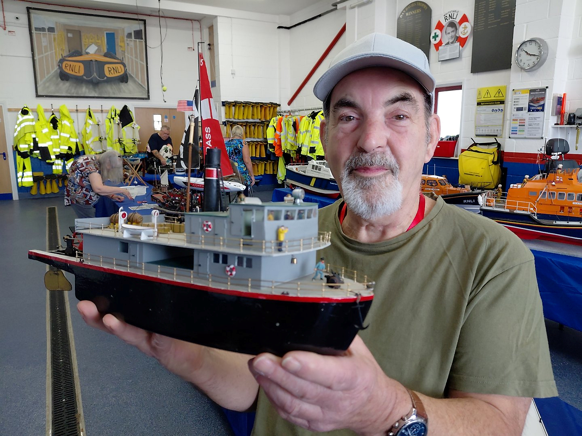 John Laker with his model of a stern wheel harbour boat during the Heron Model Boat Club display at the Whitstable RNLI Boathouse on Sunday. Picture: Chris Davey/RNLI Whitstable.CD17 : Skullduggery on the right was the winner of best model boat at the Heron Model Boat Club display at the Whitstable RNLI Boathouse on Sunday.