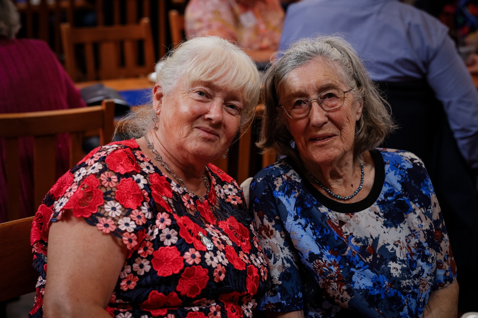 Two ladies in coloured dresses