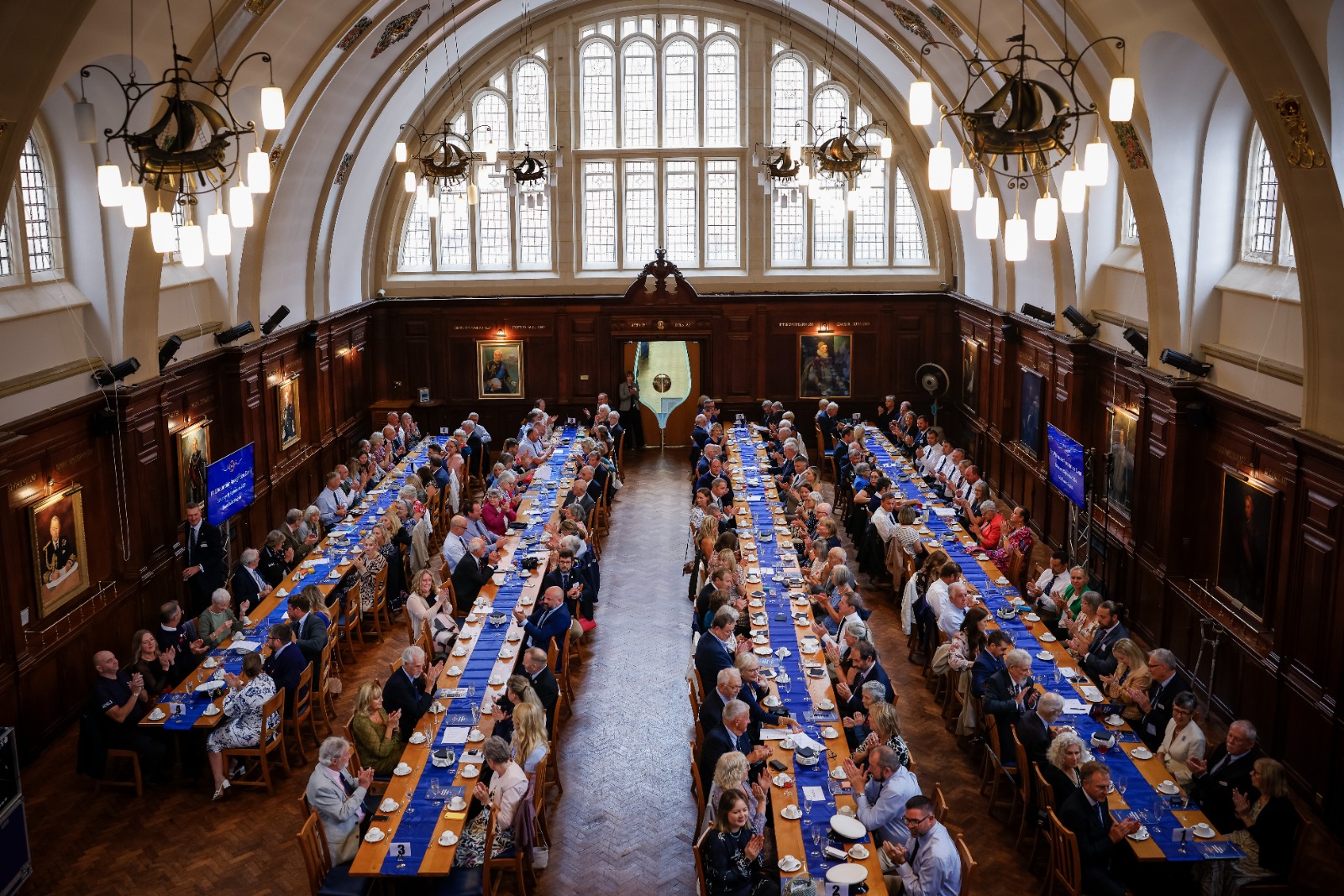 Large number of RNLI volunteers seated at long tables