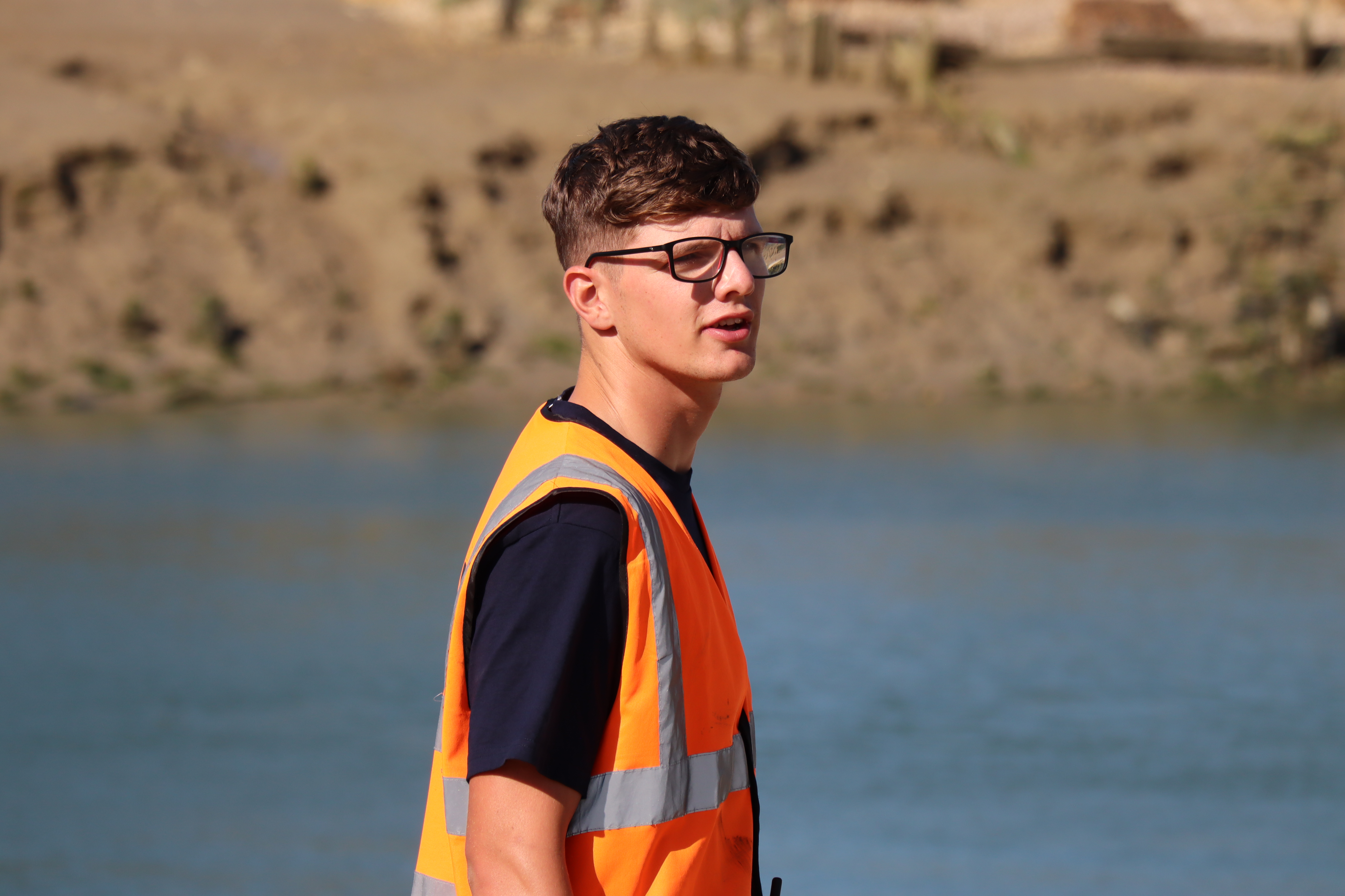 Josh Bruford in action as Head Launcher. Looking away from the camera and wearing an orange Head Launcher hi-vis