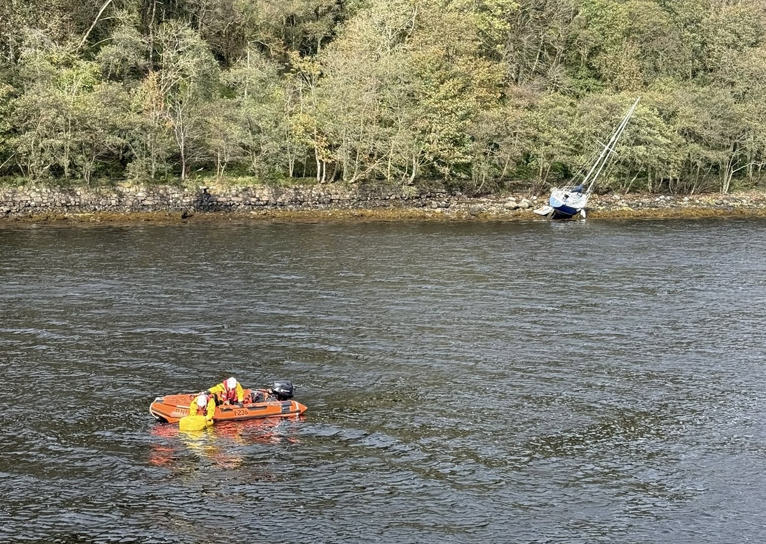 The Y boat approaching yacht aground in Loch Aline
