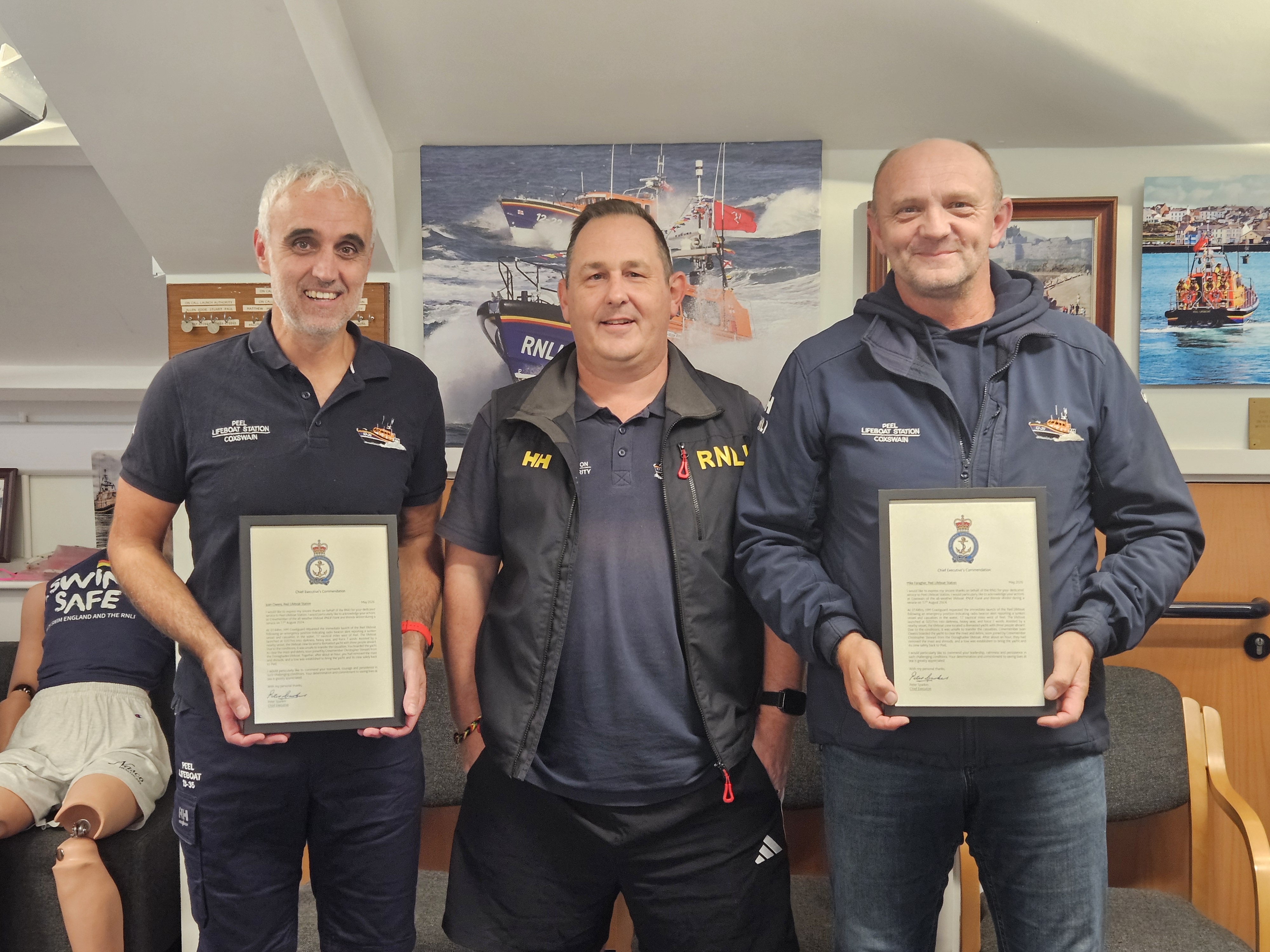 Juan and Mike accepting their awards for the yacht rescue with Paul Thompson (LOM)Paul Thompson (LOM) presenting Juan &amp; Mike with their Chief Executives Commendations
