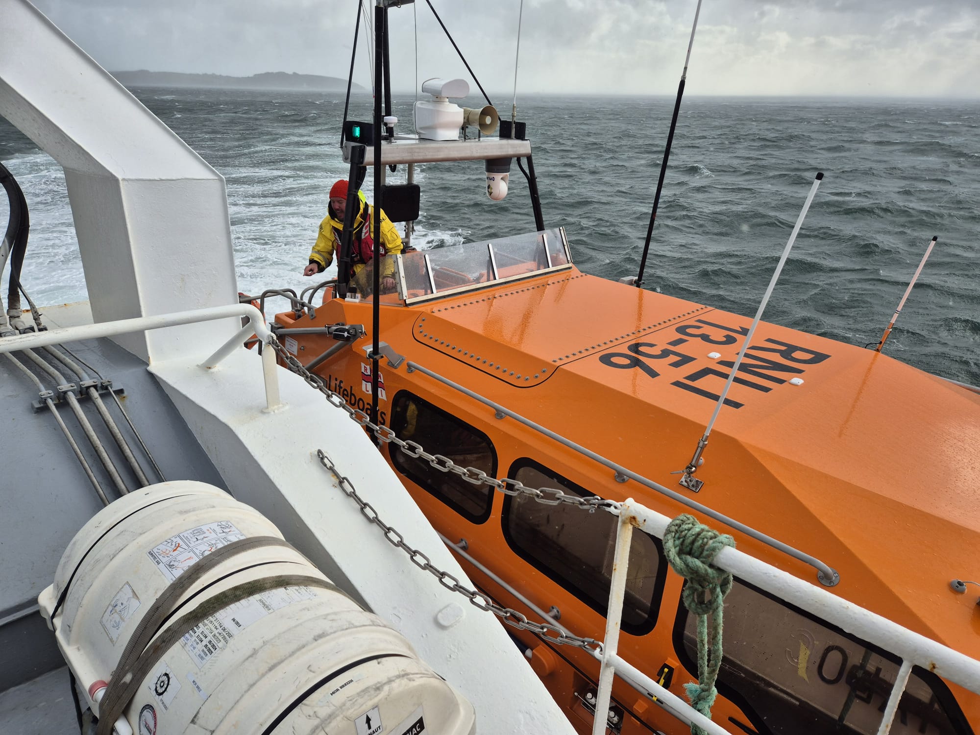Falmouth's Shannon class all-weather lifeboat Decibel Too alongside the 21-metre French fishing vessel in Falmouth Bay