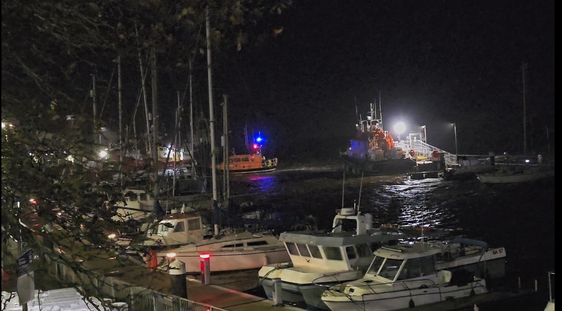 Lifeboat launching at night to persons in the water