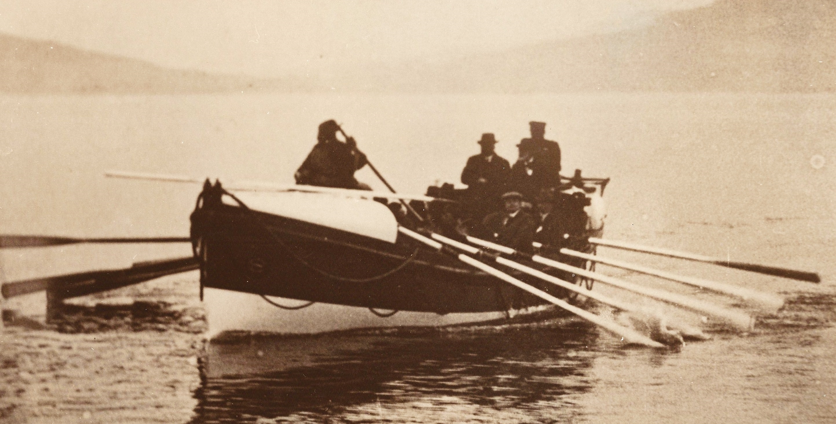 Sepia image of lifeboat being rowed