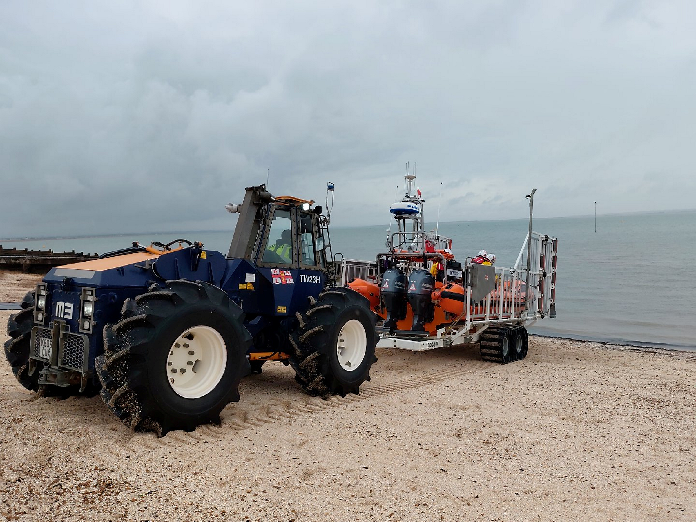 The Whitstable RNLI Talus M3 launhing tractor propels the lifeboat and launching carriage down the beach.
