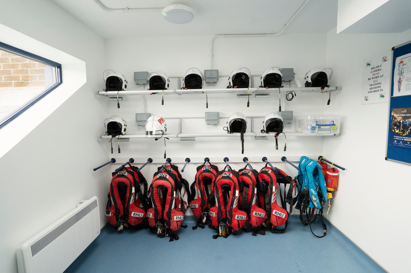 image shows helmets and life jackets on dedicated storage