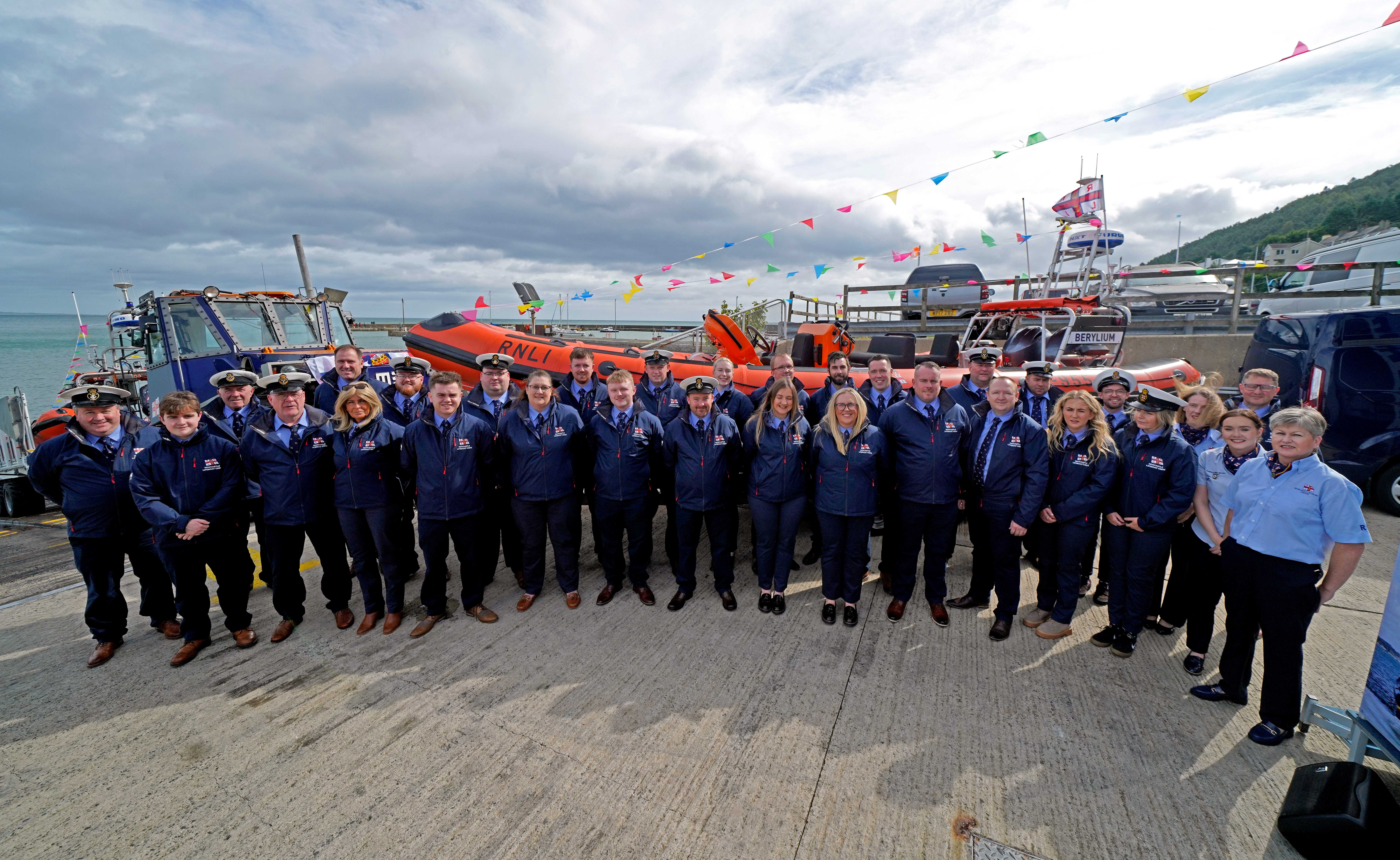 Newcastle RNLI's team of volunteers lined up in front of the Atlantic 85 class lifeboat Berylium
