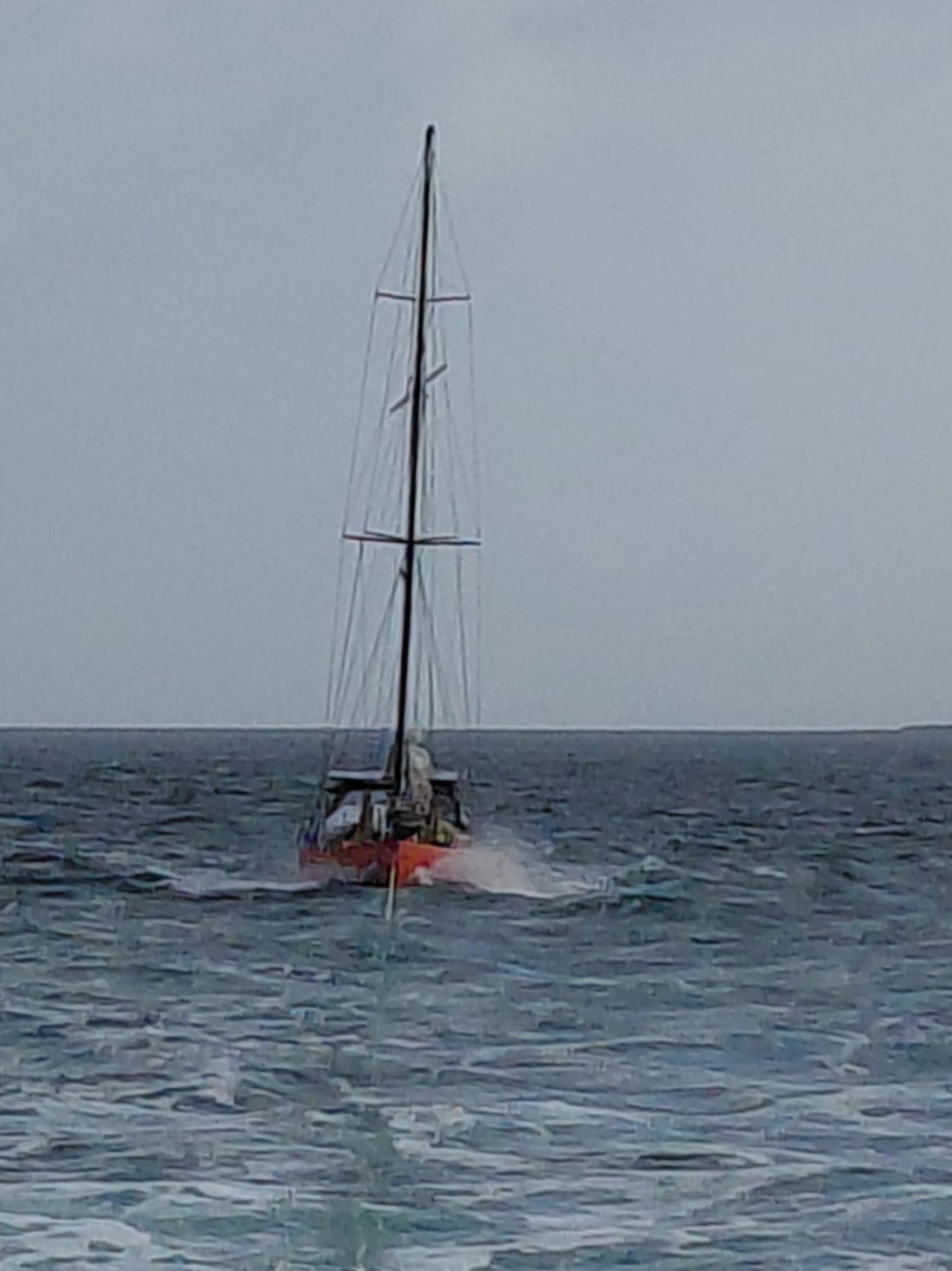 Yacht being towed through the sea.
