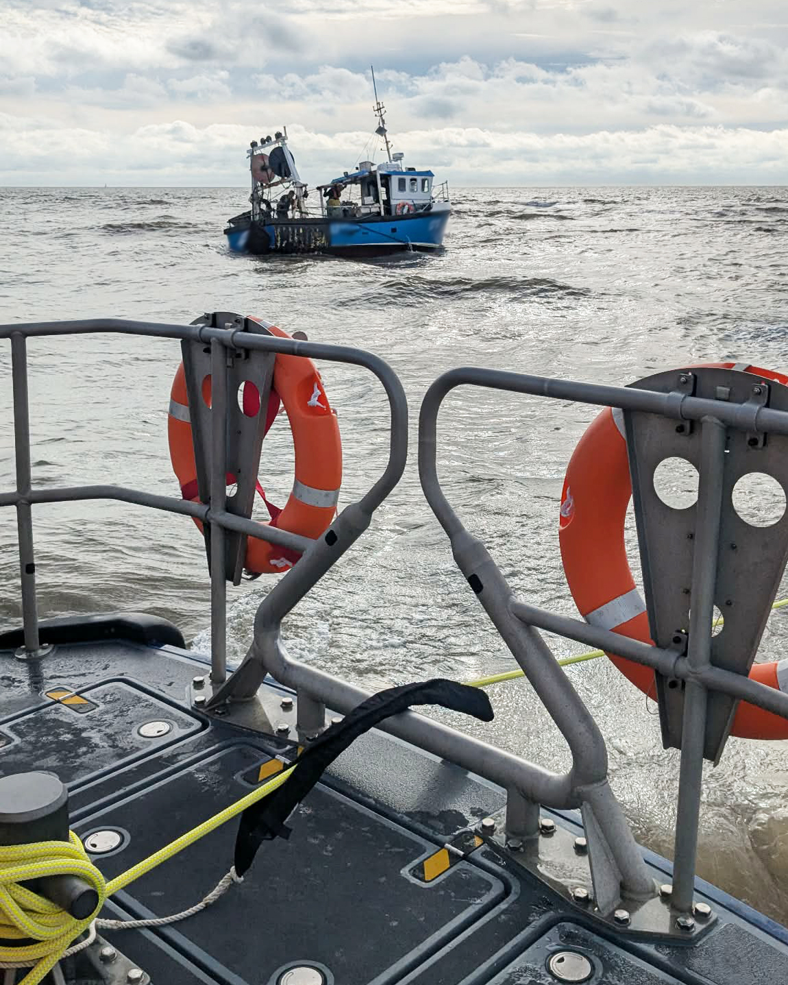 Lowestoft RNLI lifeboat towing the fishing boat after being freed from the sandbank