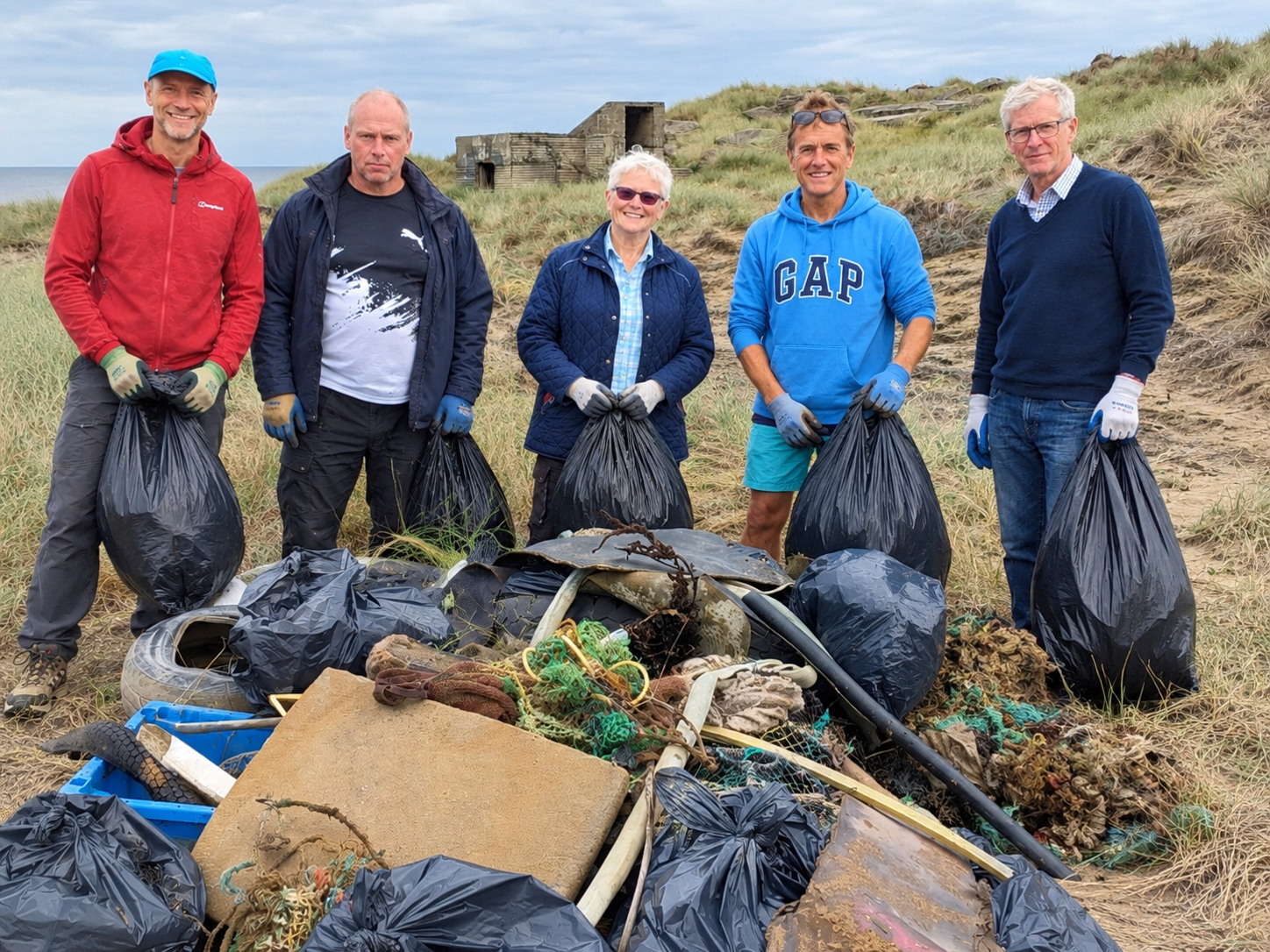 Some of the volunteers with part of the debris