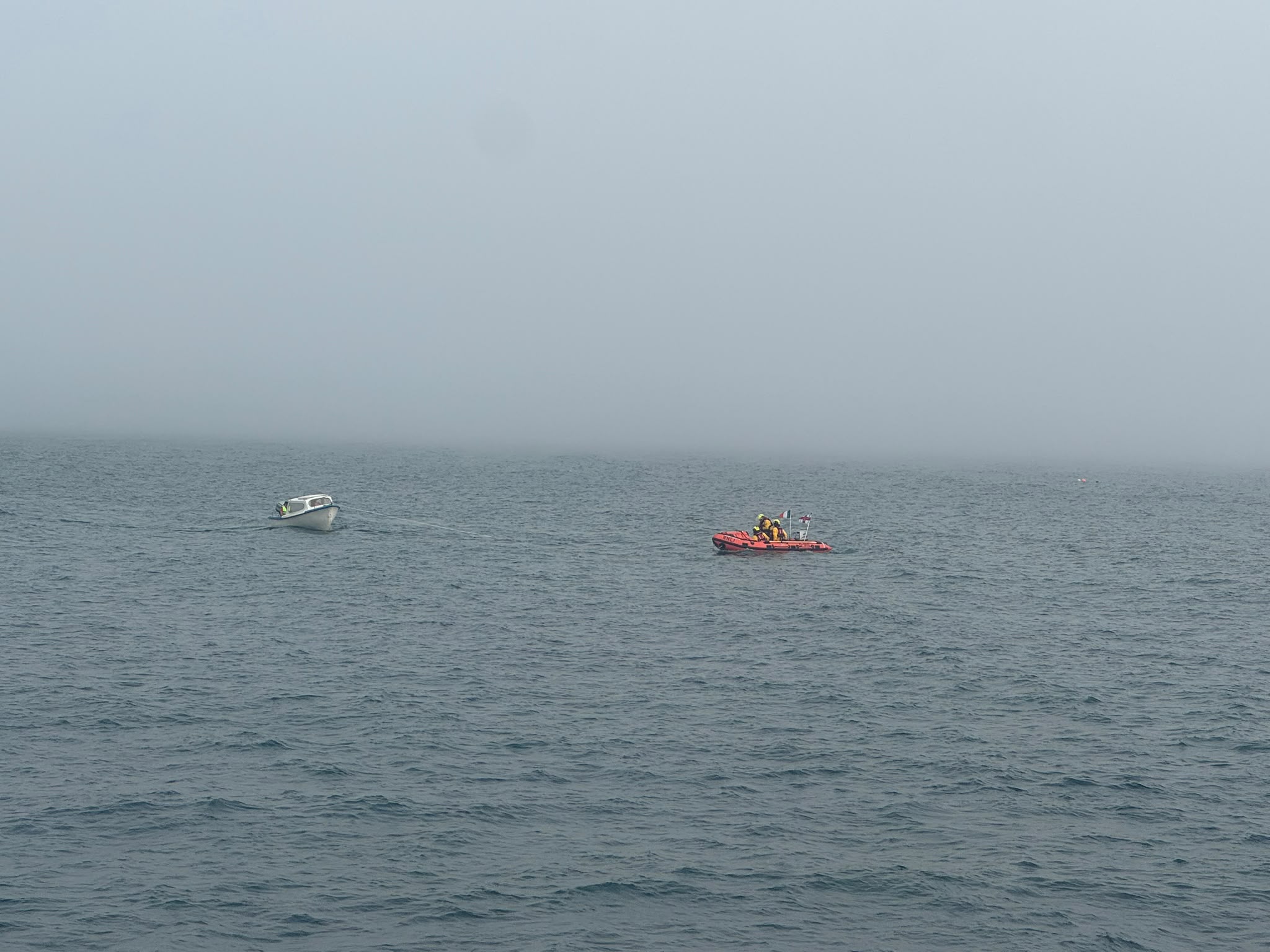 Tramore D class RNLI lifeboat assisting 18 ft fishing boat with engine failure