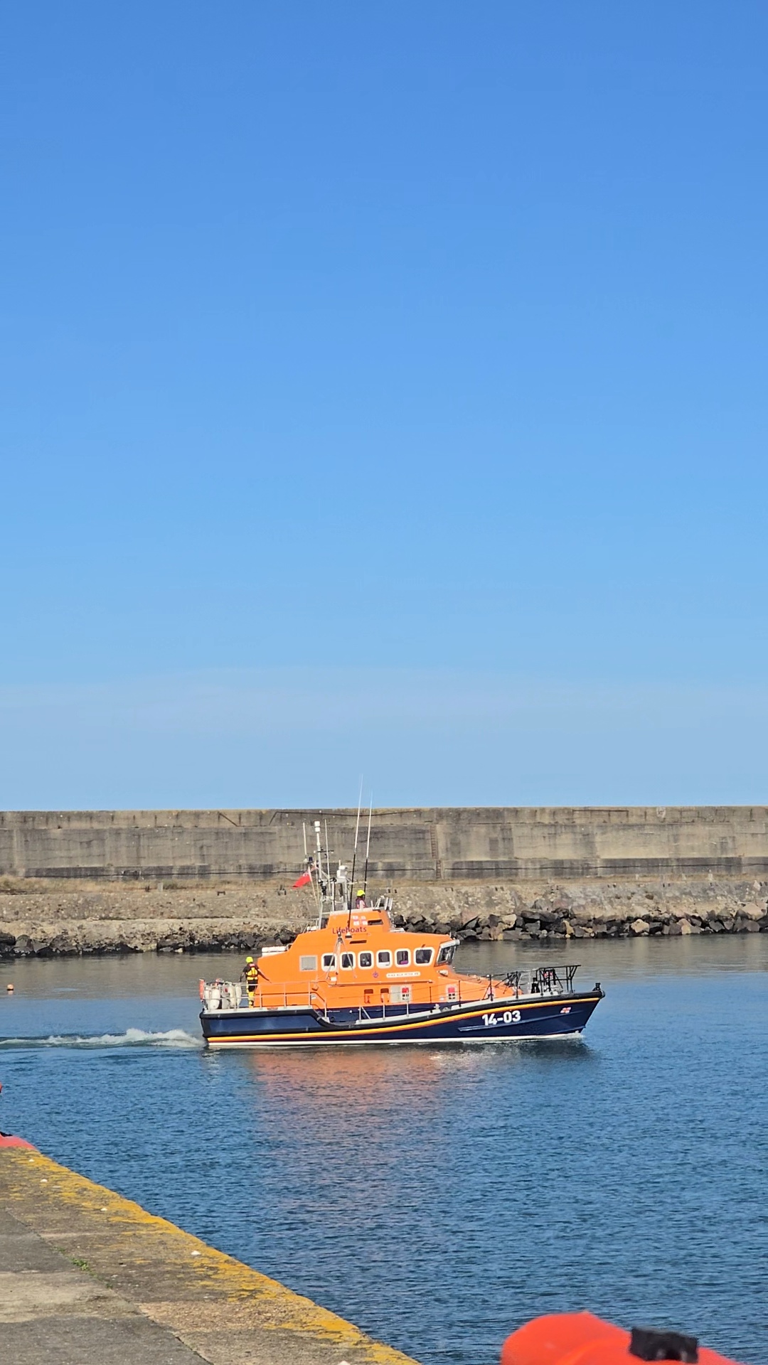 Fishguard RNLI Trent class lifeboat Blue Peter VII launching to assist the 38ft casualty yacht.