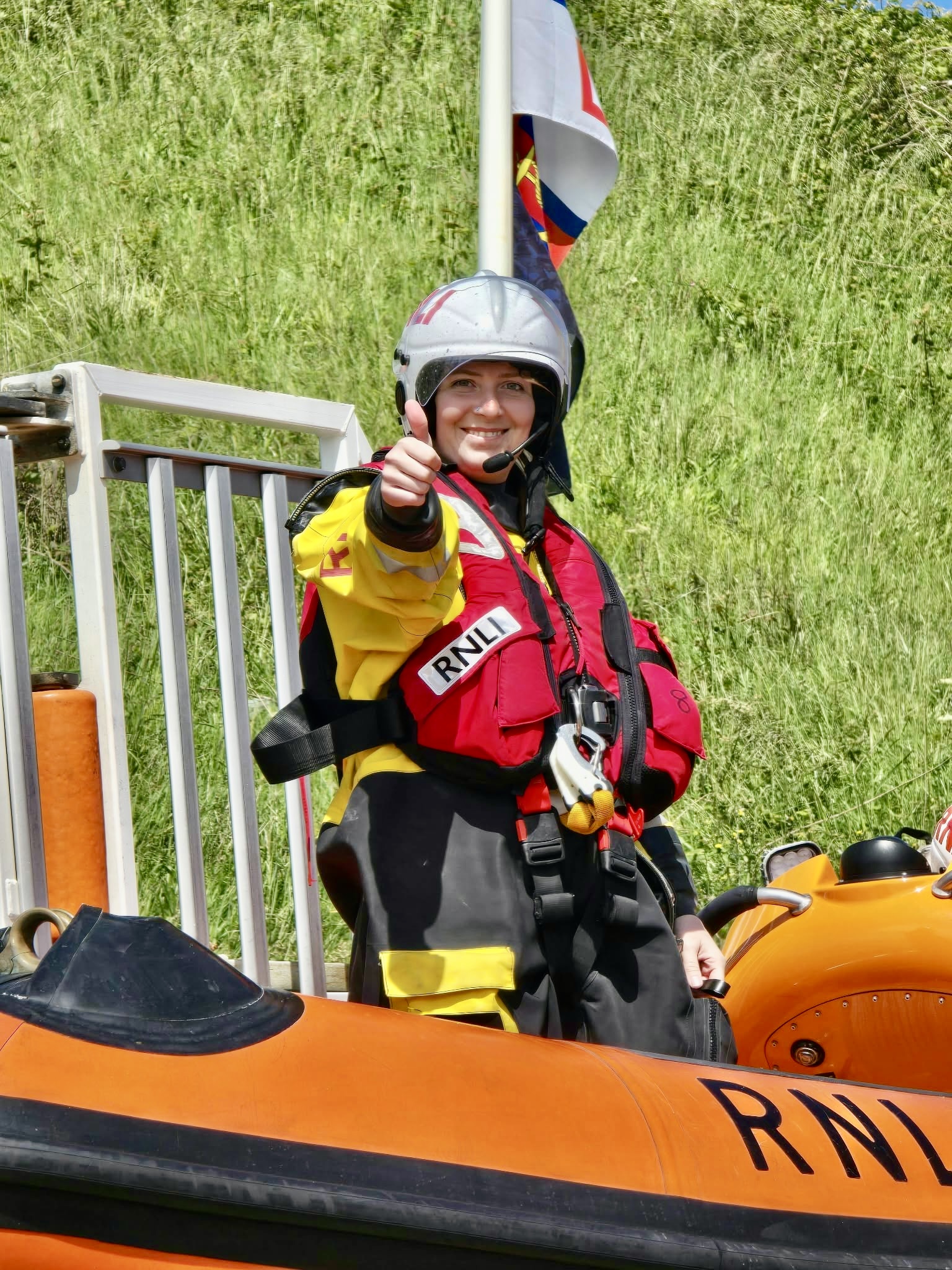 Diane on board Flamborough Lifeboat giving a thumbs up