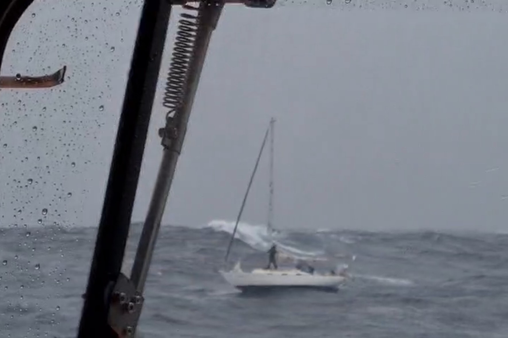 The stricken yacht with one sailor aboard as Lerwick lifeboat approached. 