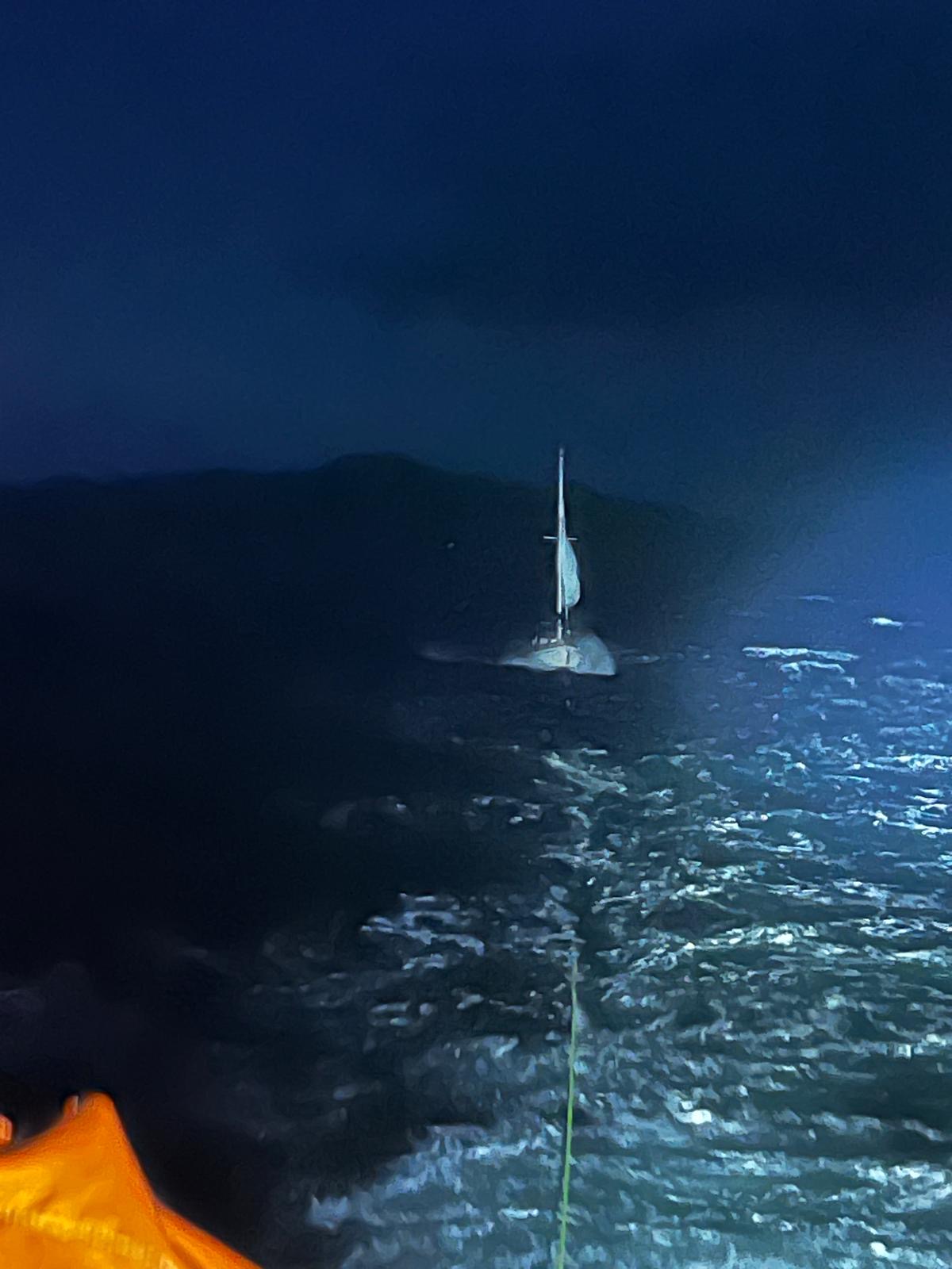 Yacht under tow in gale force winds