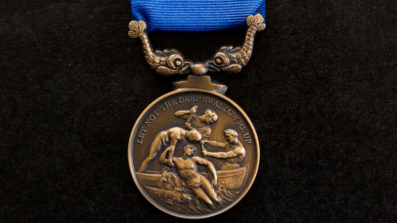 An RNLI Bronze Medal for Gallantry, engraved with the motto: ‘let not the deep swallow me up’, from Psalm 69:15