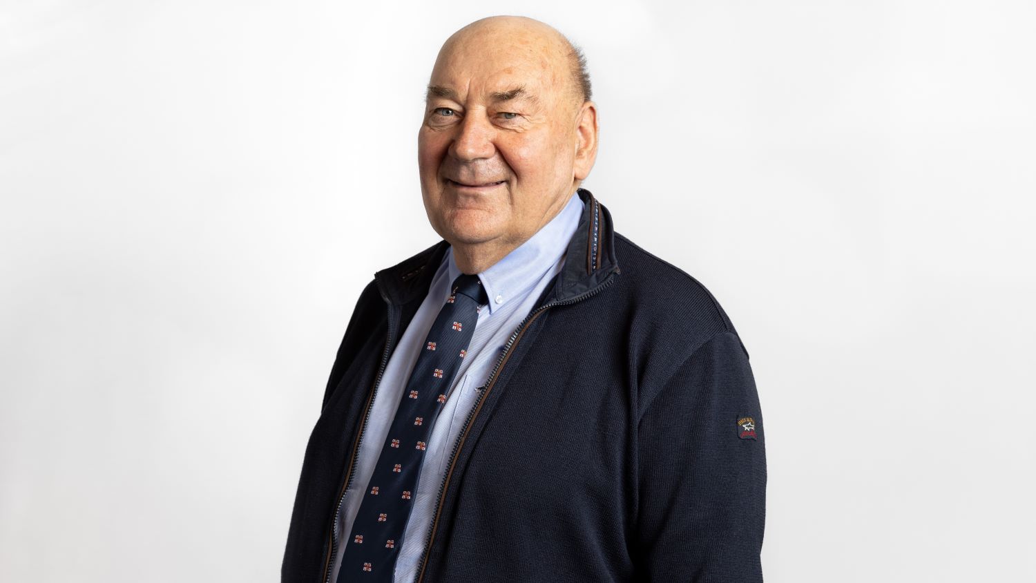 Headshot of a man wearing a suit