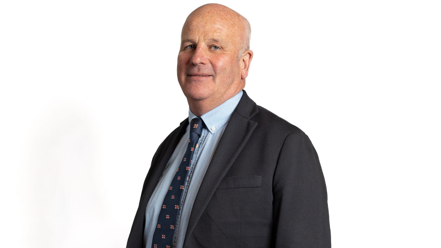 Headshot of a man wearing a suit