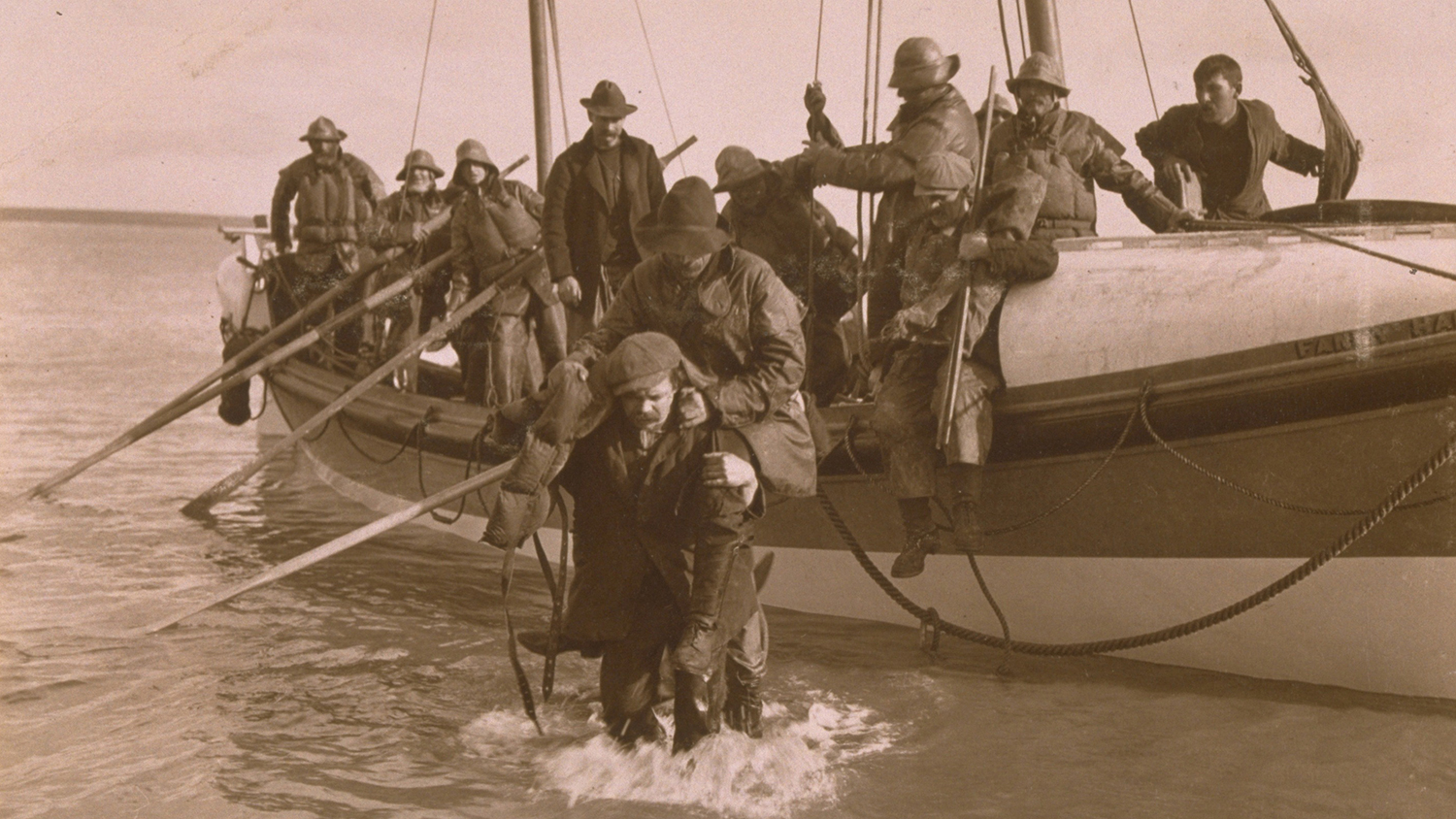Lifeboat crew helping survivors of the Fethard lifeboat disaster in 1914