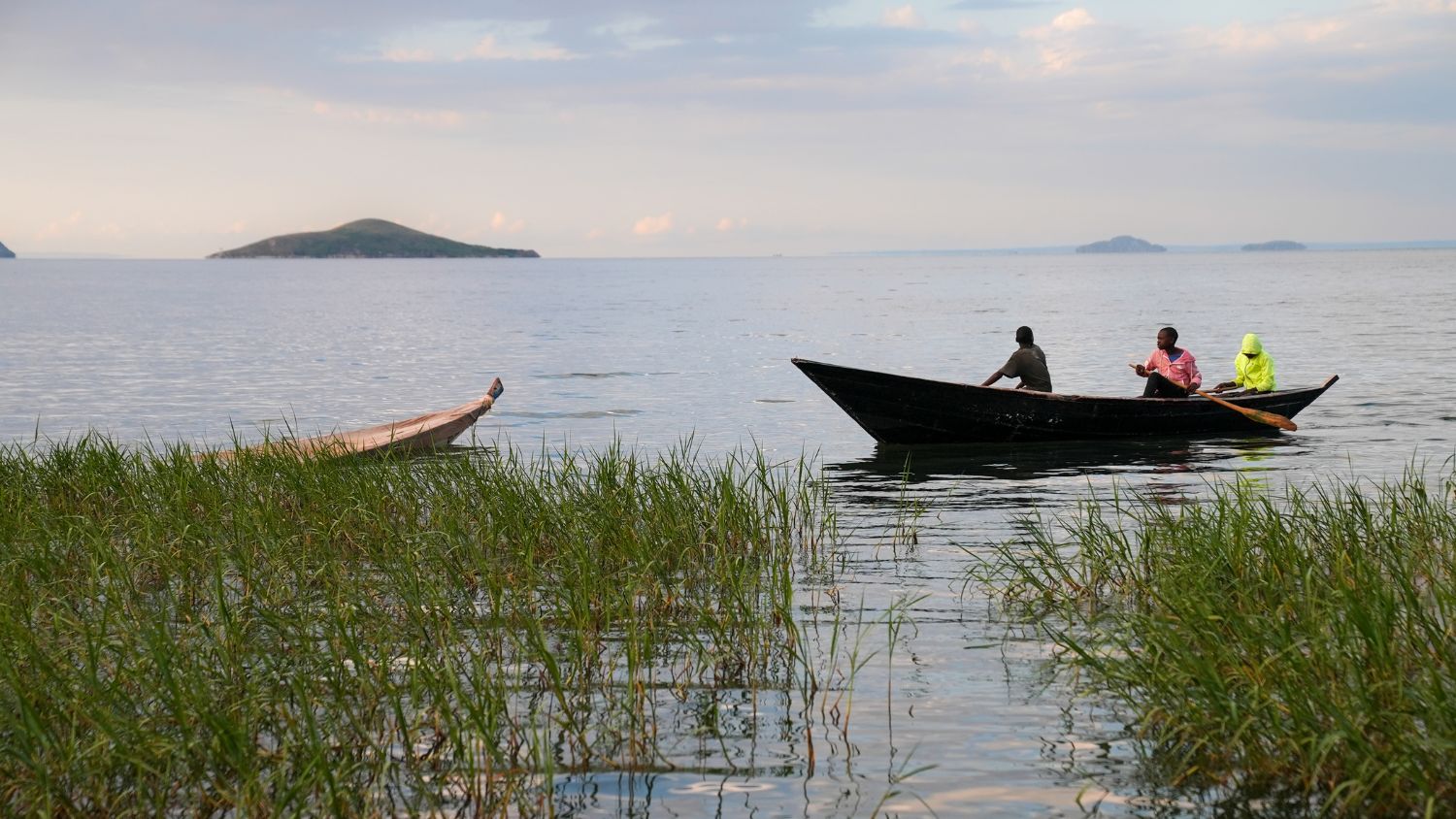 Photo of people on fishing boat taken during visit to Tanzania in 2022